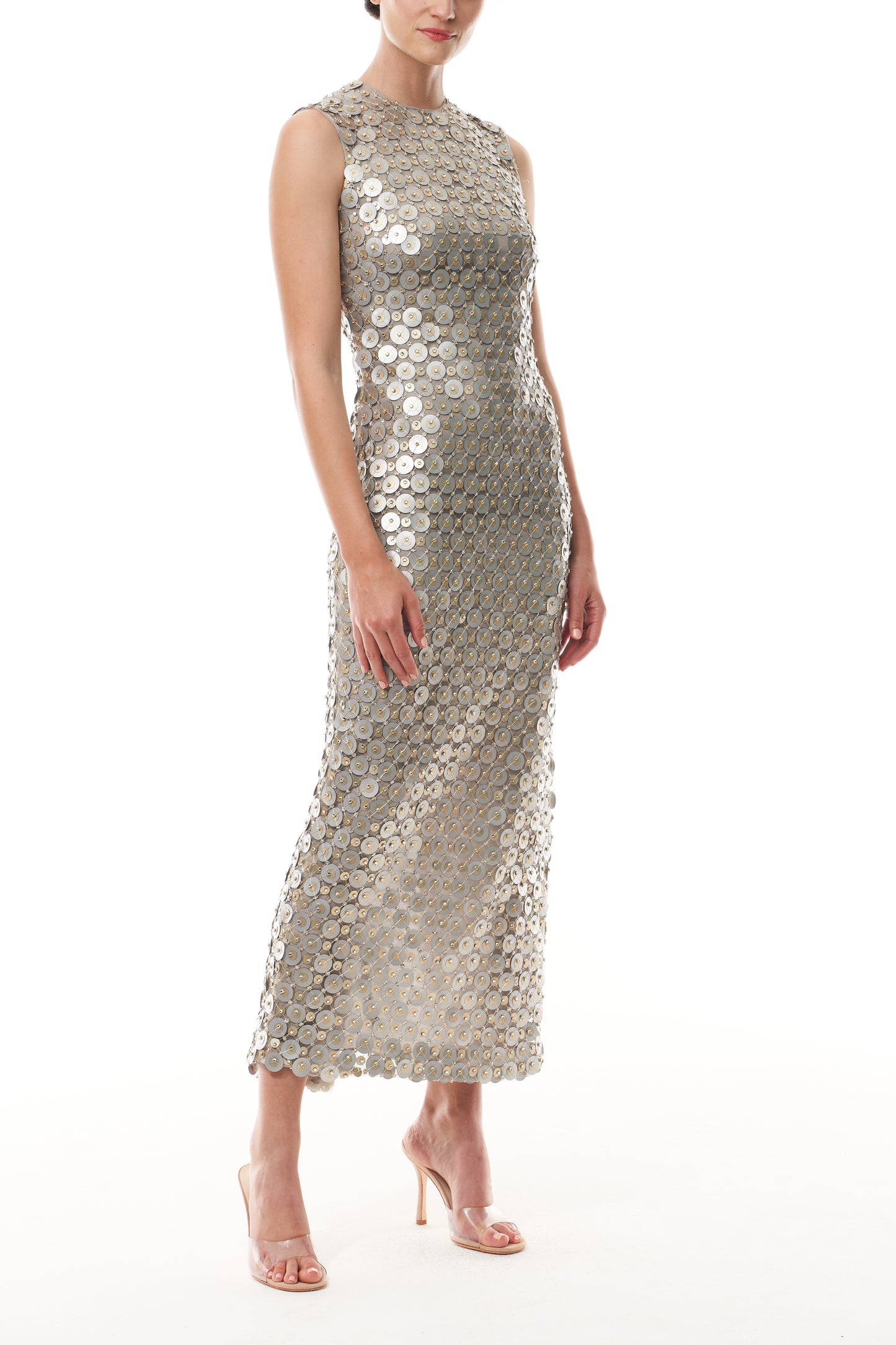 Monique Lhuillier Fall 2025 Sleeveless, tea-length shift dress in silver & gold disc embroidery - side.