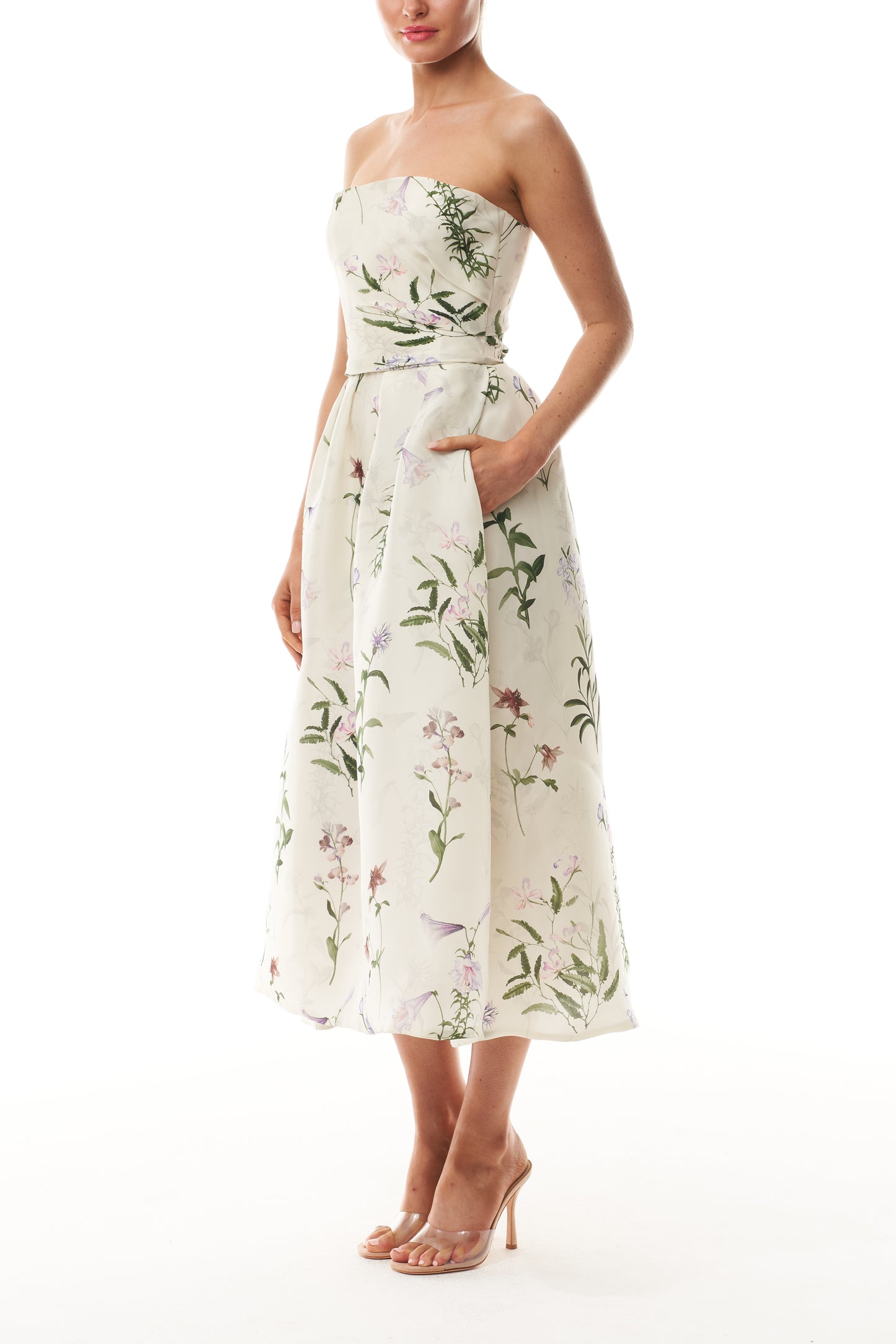 Monique Lhuillier Fall 2025 strapless dress with pleated waistline in floral printed gazar fabric - side.