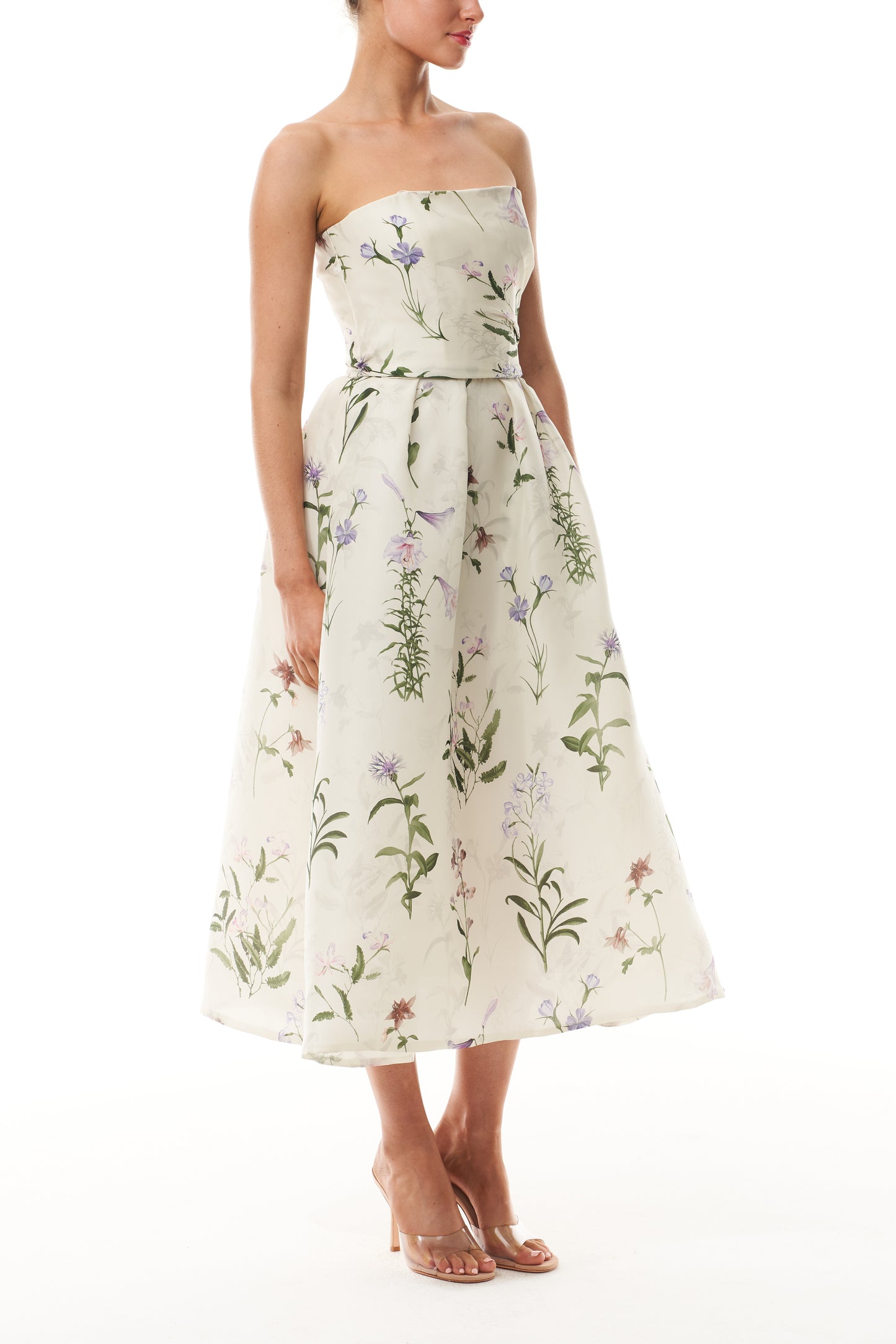 Monique Lhuillier Fall 2025 strapless dress with pleated waistline in floral printed gazar fabric - side.