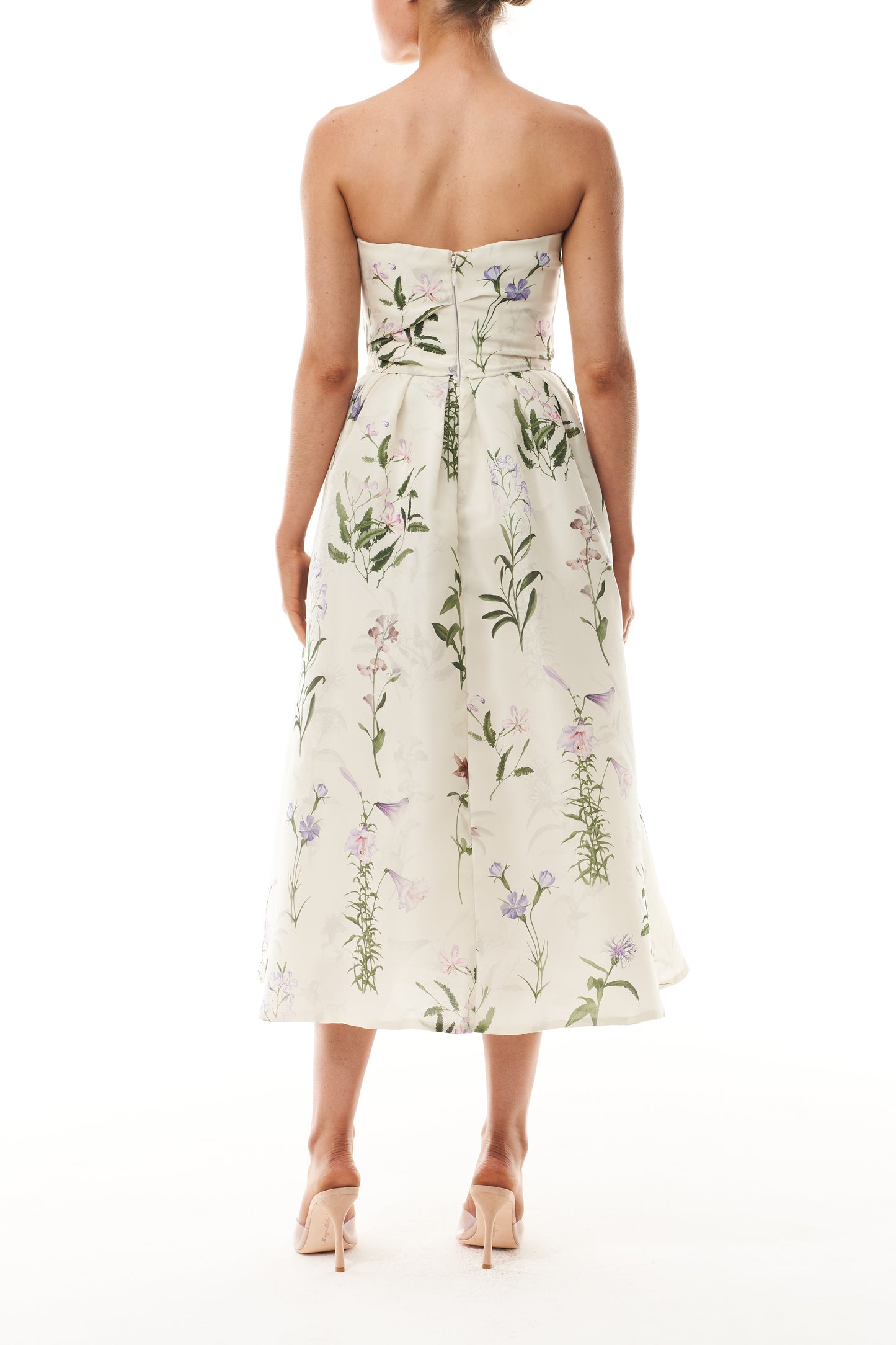 Monique Lhuillier Fall 2025 strapless dress with pleated waistline in floral printed gazar fabric - back.