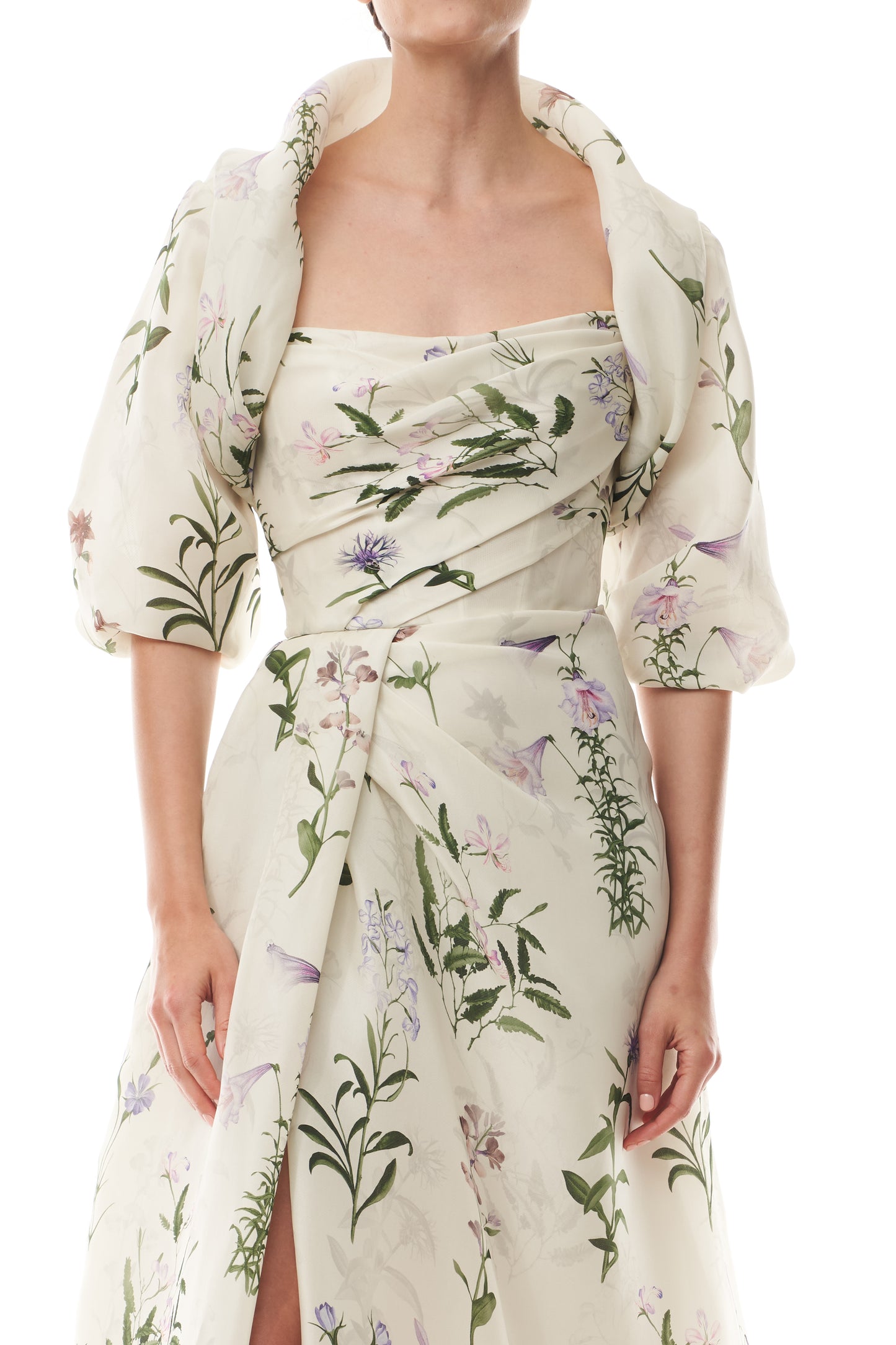 Monique Lhuillier Fall 2025 high neck bolero in floral gazar shown over the matching strapless gown.