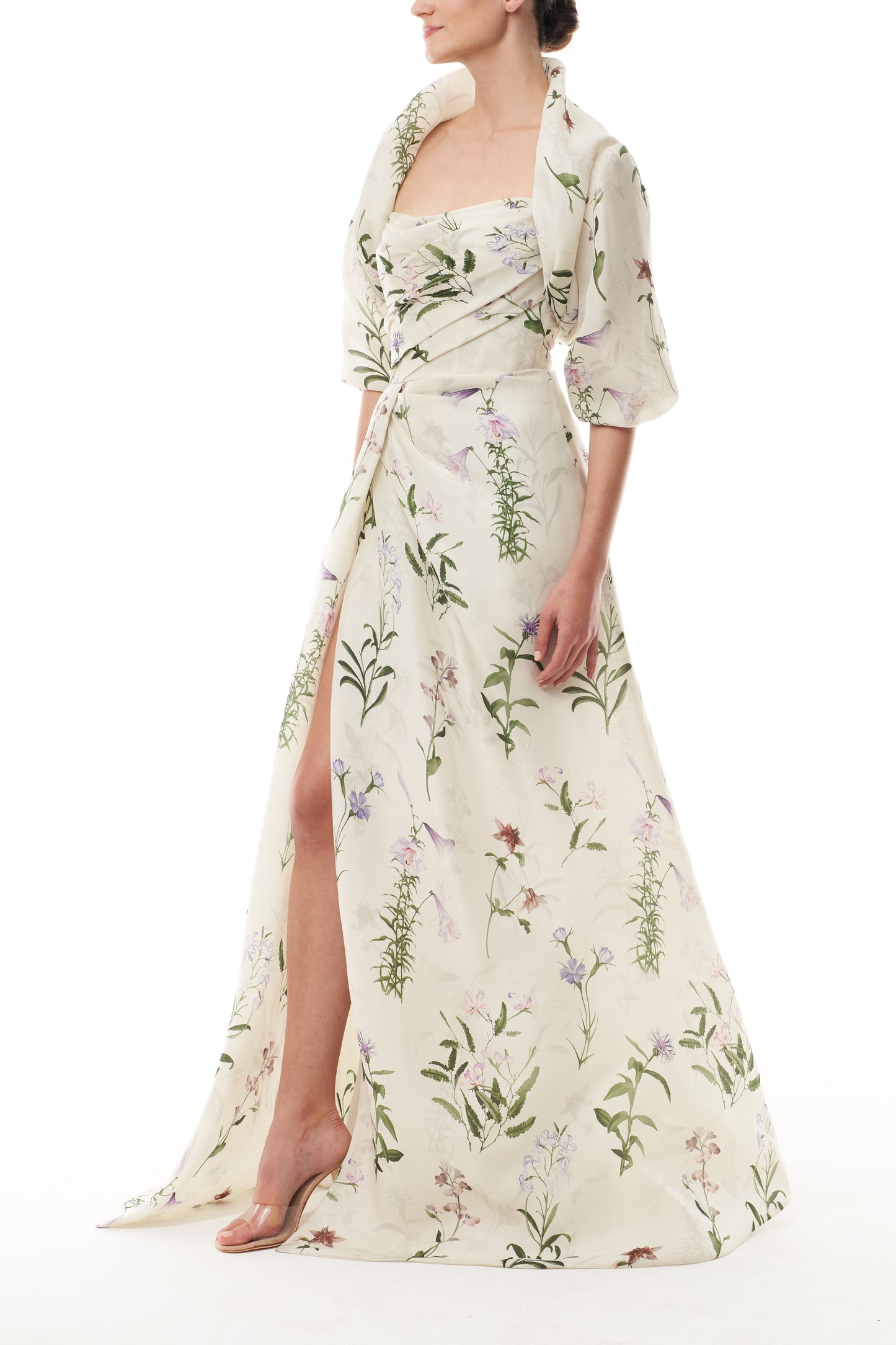 Monique Lhuillier Fall 2025 high neck bolero in floral gazar shown over the matching strapless gown - side.