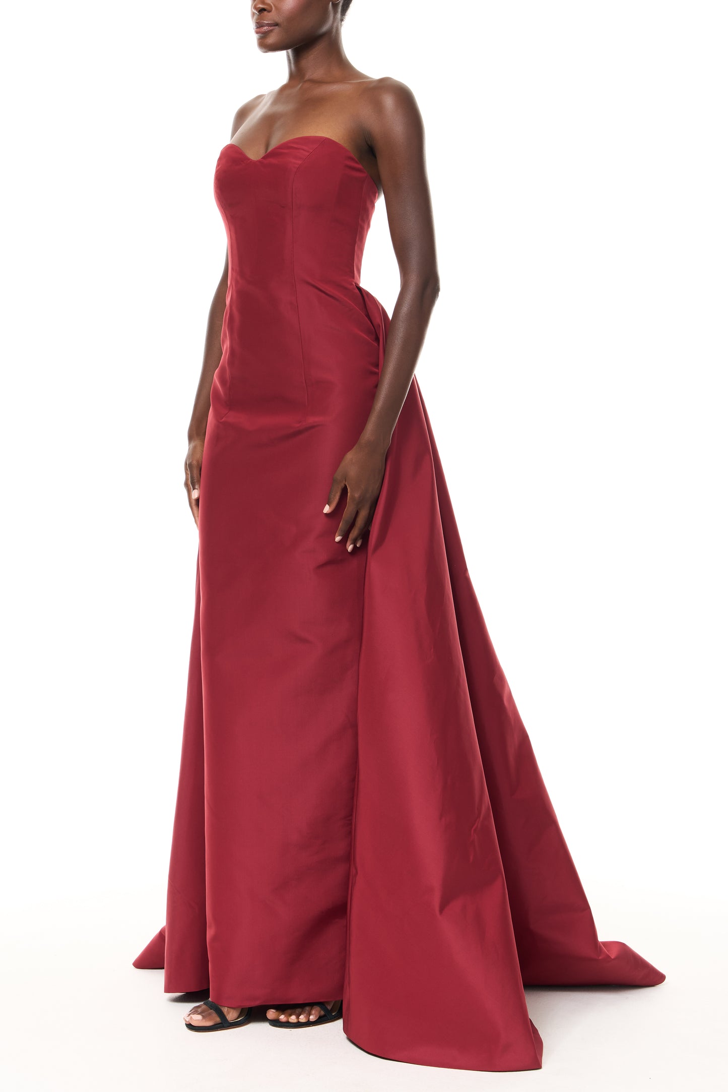 Monique Lhuillier Fall 2025 Siren Faille Strapless column gown with train - side.
