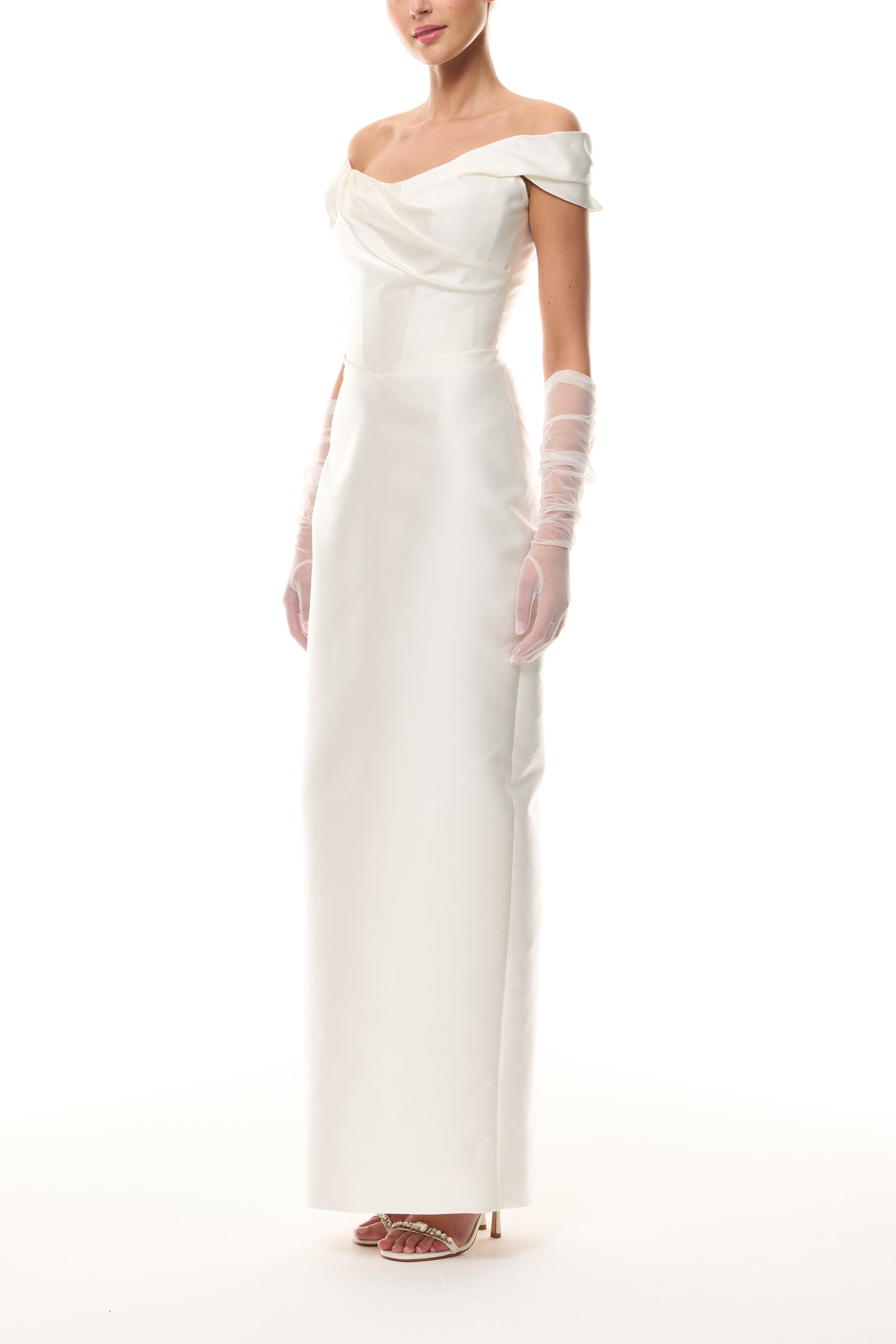 Monique Lhuillier Silk White Mikado Off-the-shoulder draped bodice column gown from The Bridal Edit- side with Silk White Charming Tulle Gloves.