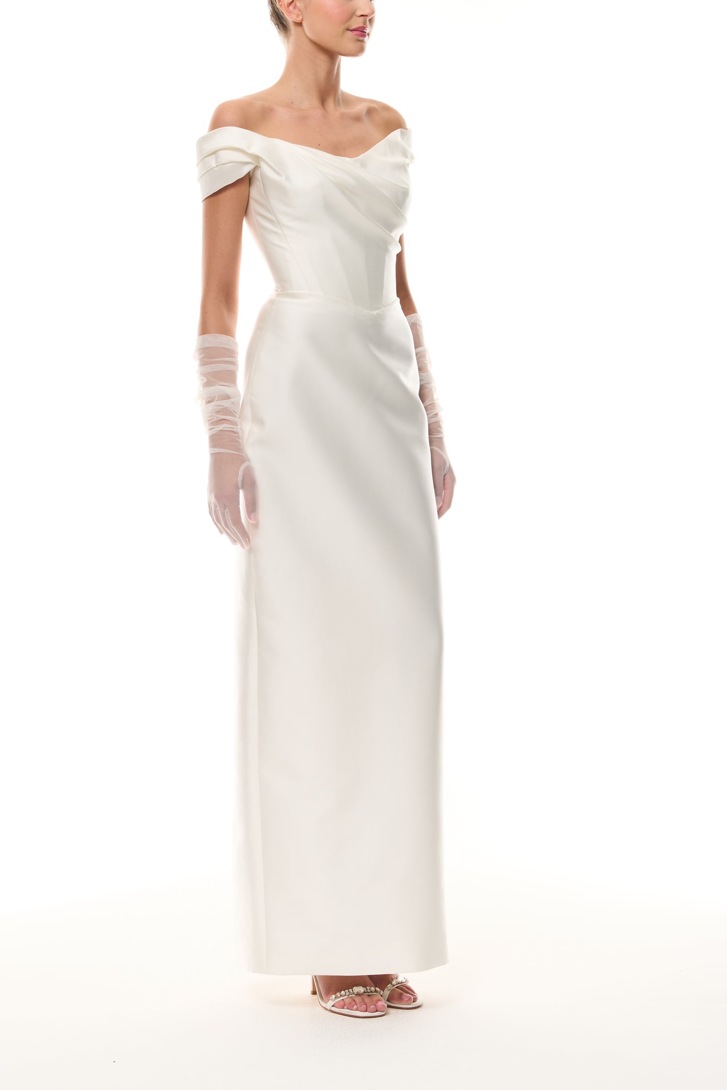 Monique Lhuillier Silk White Mikado Off-the-shoulder draped bodice column gown from The Bridal Edit- side with Silk White Charming Tulle Gloves.