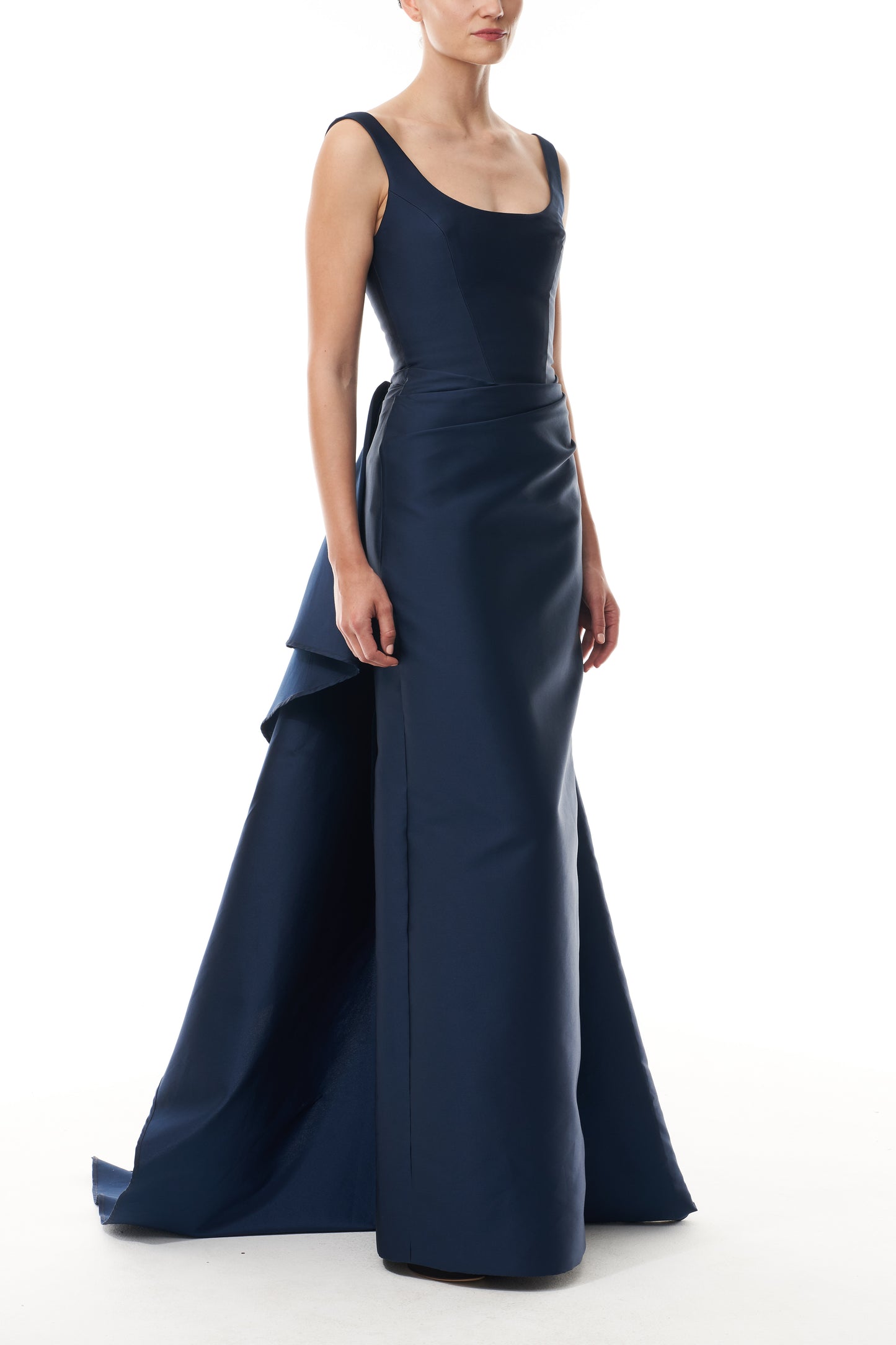 Monique Lhuillier Fall 2025 Ocean Mikado Draped column gown with integral train - side.
