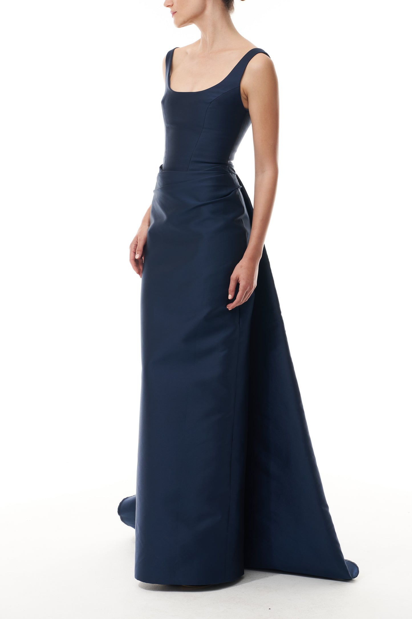 Monique Lhuillier Fall 2025 Ocean Mikado Draped column gown with integral train - side.