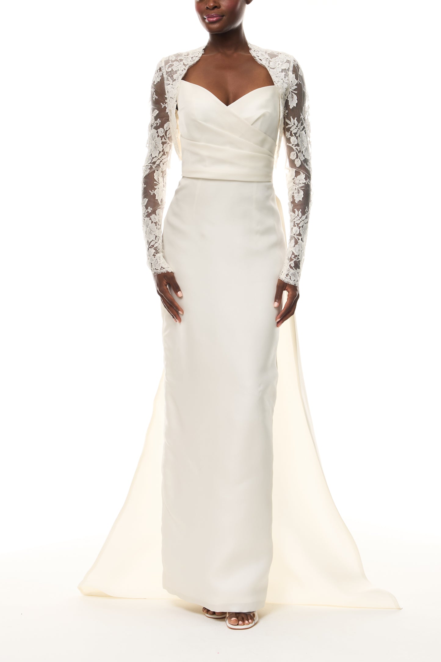 Monique Lhuillier Draped Bodice Column Gown in Ivory Gazar from The Bridal Edit - front with lace long sleeve bolero.