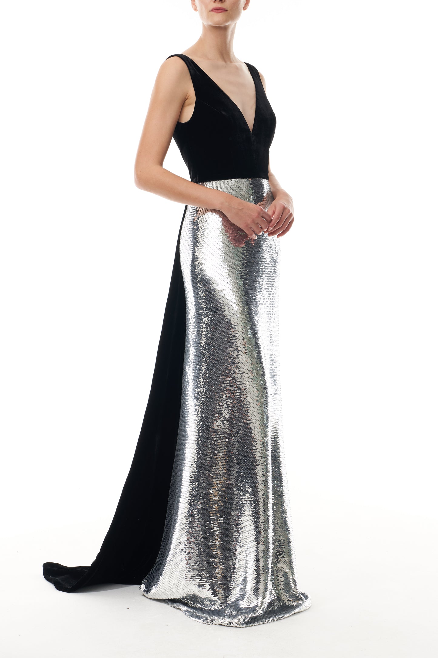 Monique Lhuillier Fall 2025 deep v-neck gown with train in noir velvet and silver sequins - side.