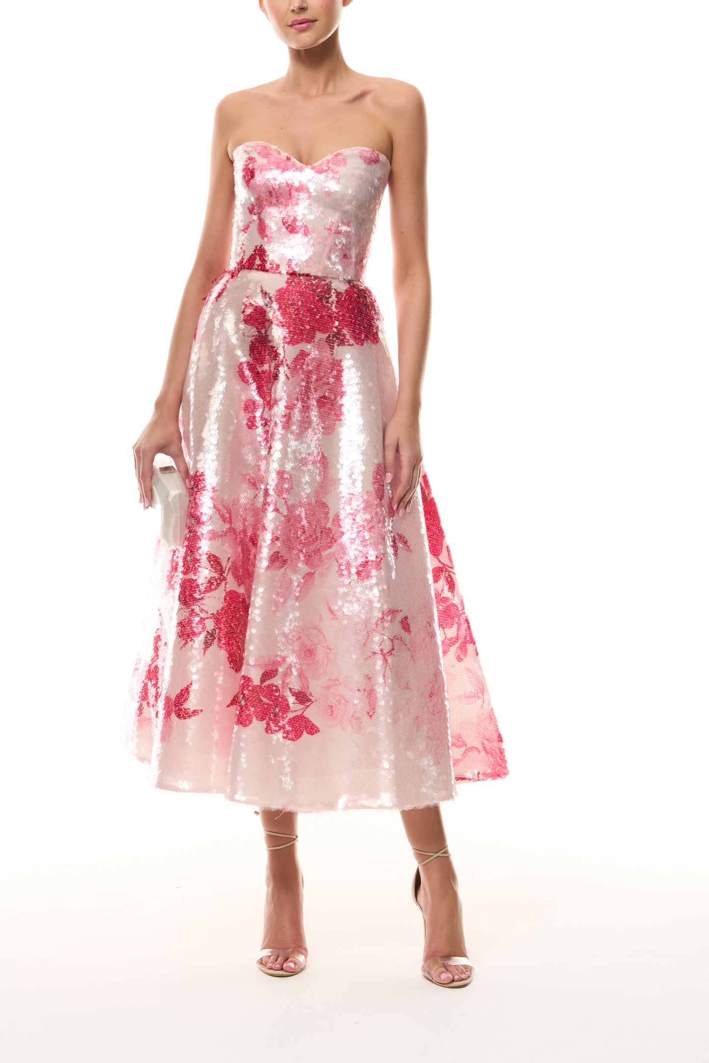 Monique Lhuillier Spring 2026 Rose Ombre Printed Sequin Pink/Multi Strapless sweetheart tea length cocktail dress - front with Crystal Dust Dasha Minaudière