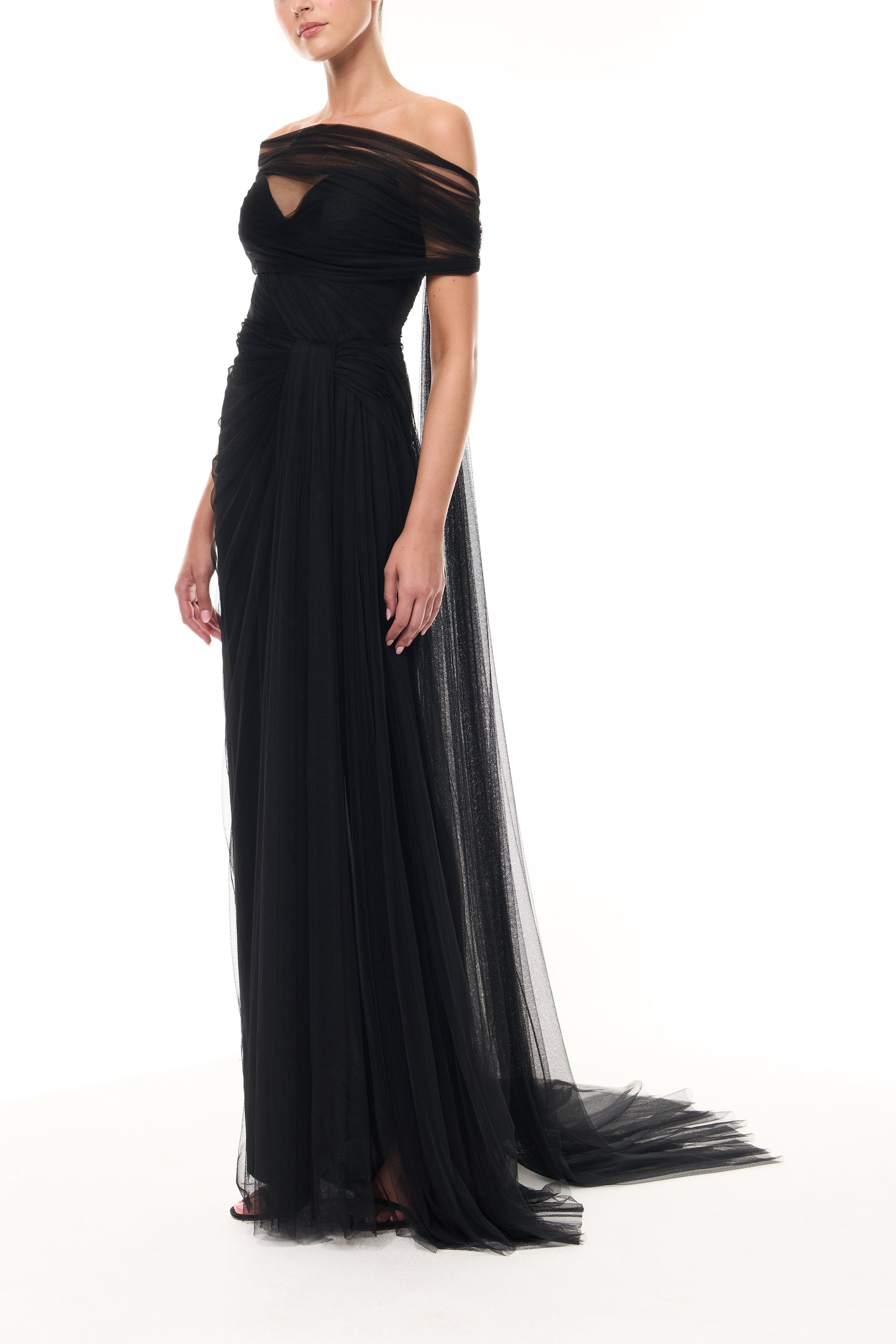 Monique Lhuillier Spring 2026 Strapless draped gown with detachable wrap
and streamers in Noir Spanish tulle- side.