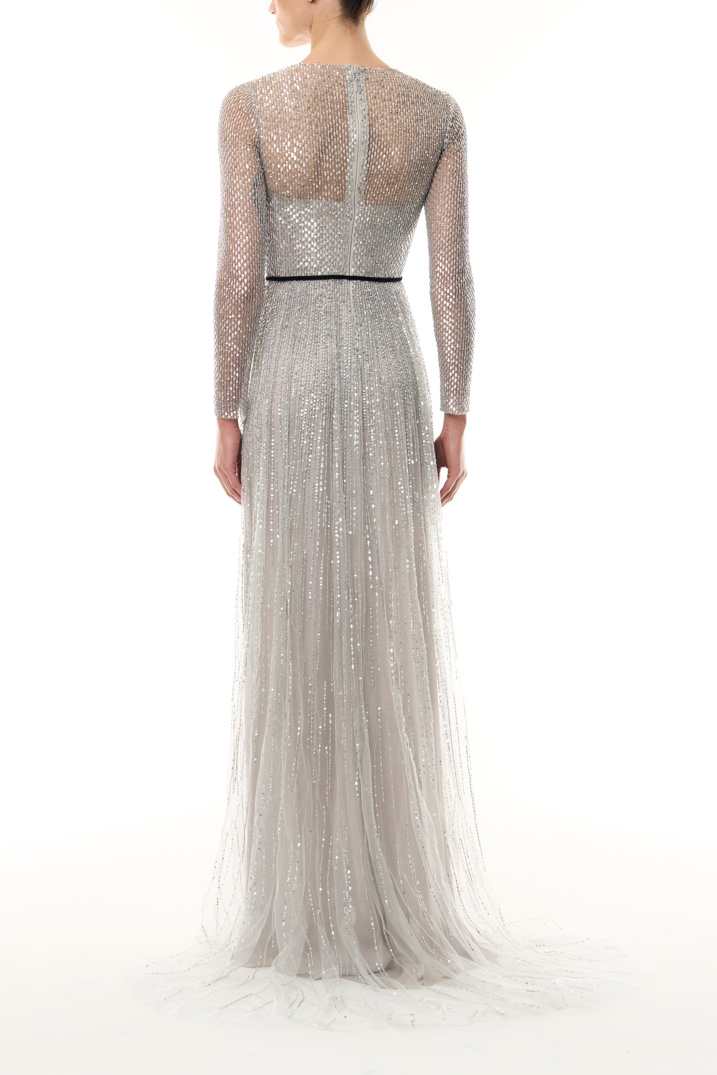 Monique Lhuillier Fall 2026 silver, long sleeve embroidered tulle gown with black velvet belt at waist - back.