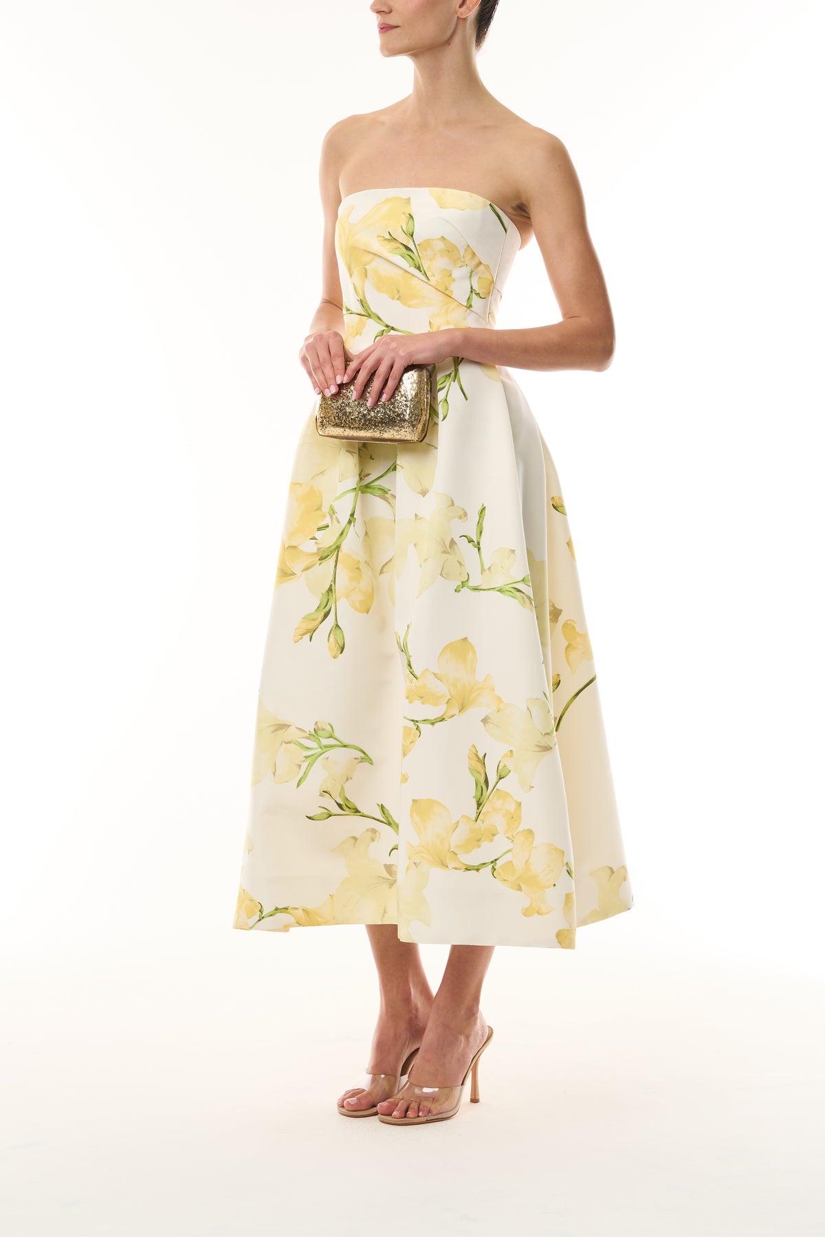 Monique Lhuillier pale yellow/multi Snapdragon Printed Faille Strapless Tea Length Dress - side with gold Dasha Minaudiere.