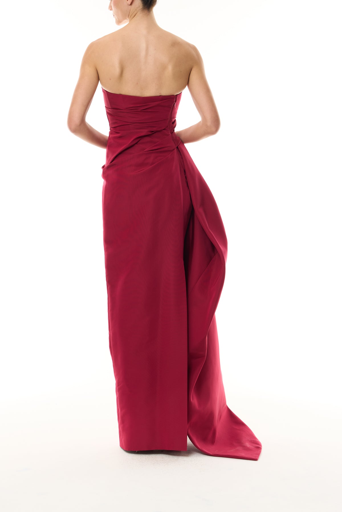 Monique Lhuillier Fall 2026 silk faille red strapless asymmetric draped column gown with side train - back.