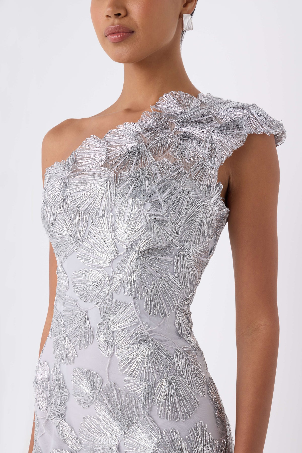 Monique Lhuillier Spring 2027 silver embroidered tulle one-shoulder tea length column gown - fabric.