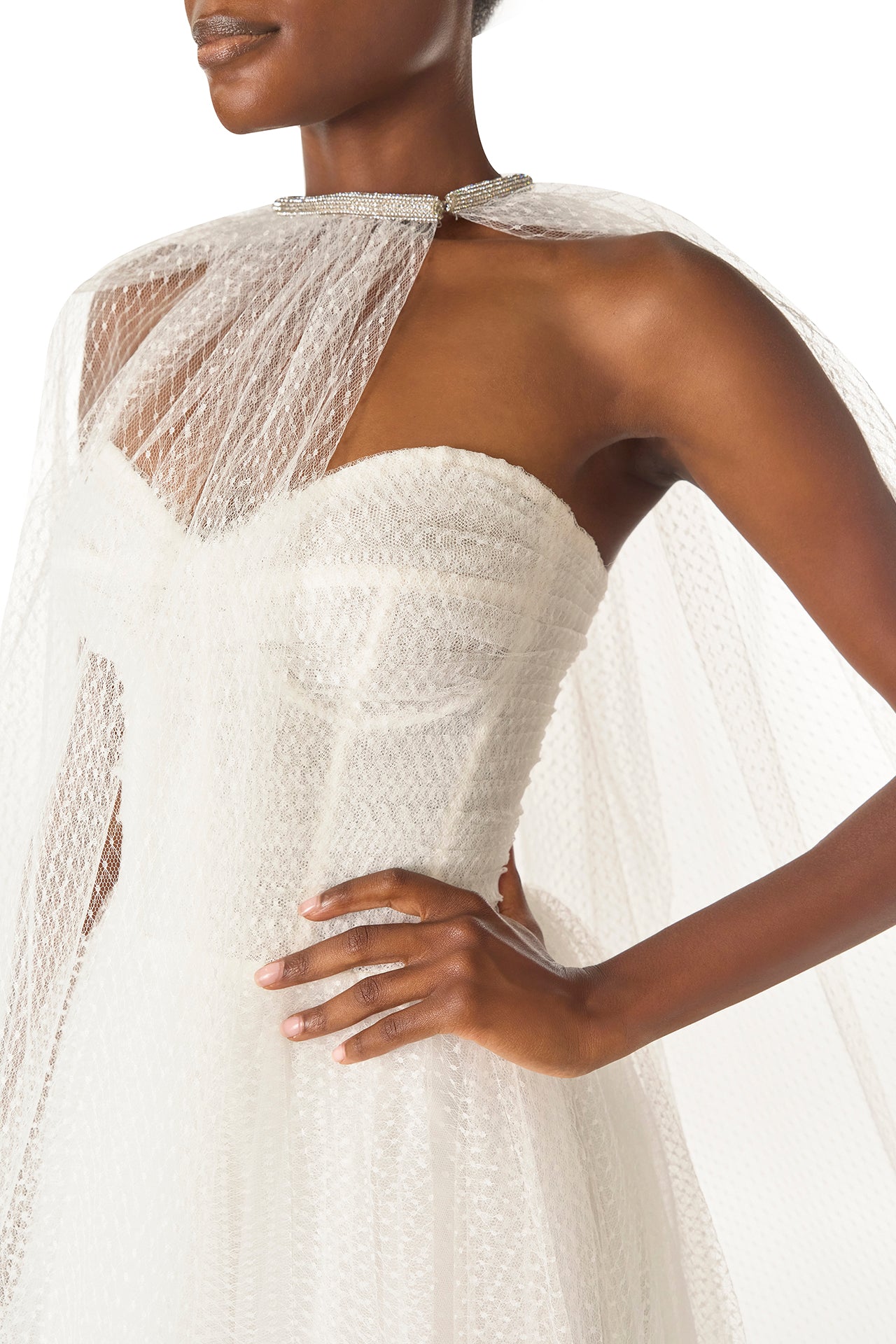 Monique Lhuillier "Brie Dress".
Strapless, tea length dress with sweetheart neckline in French Dot Tulle - Brie cape detail.