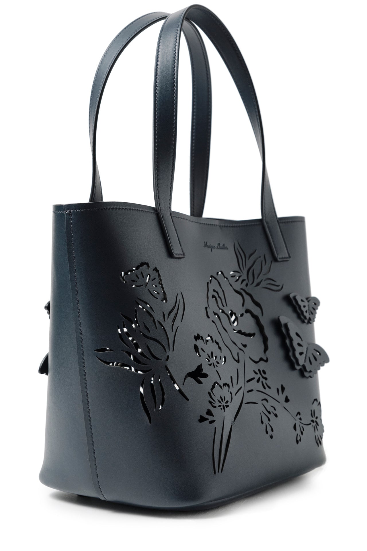 Leather top handle tote bag with laser cut florals, three-dimensional leather butterflies and small zip pouch in Navy- side