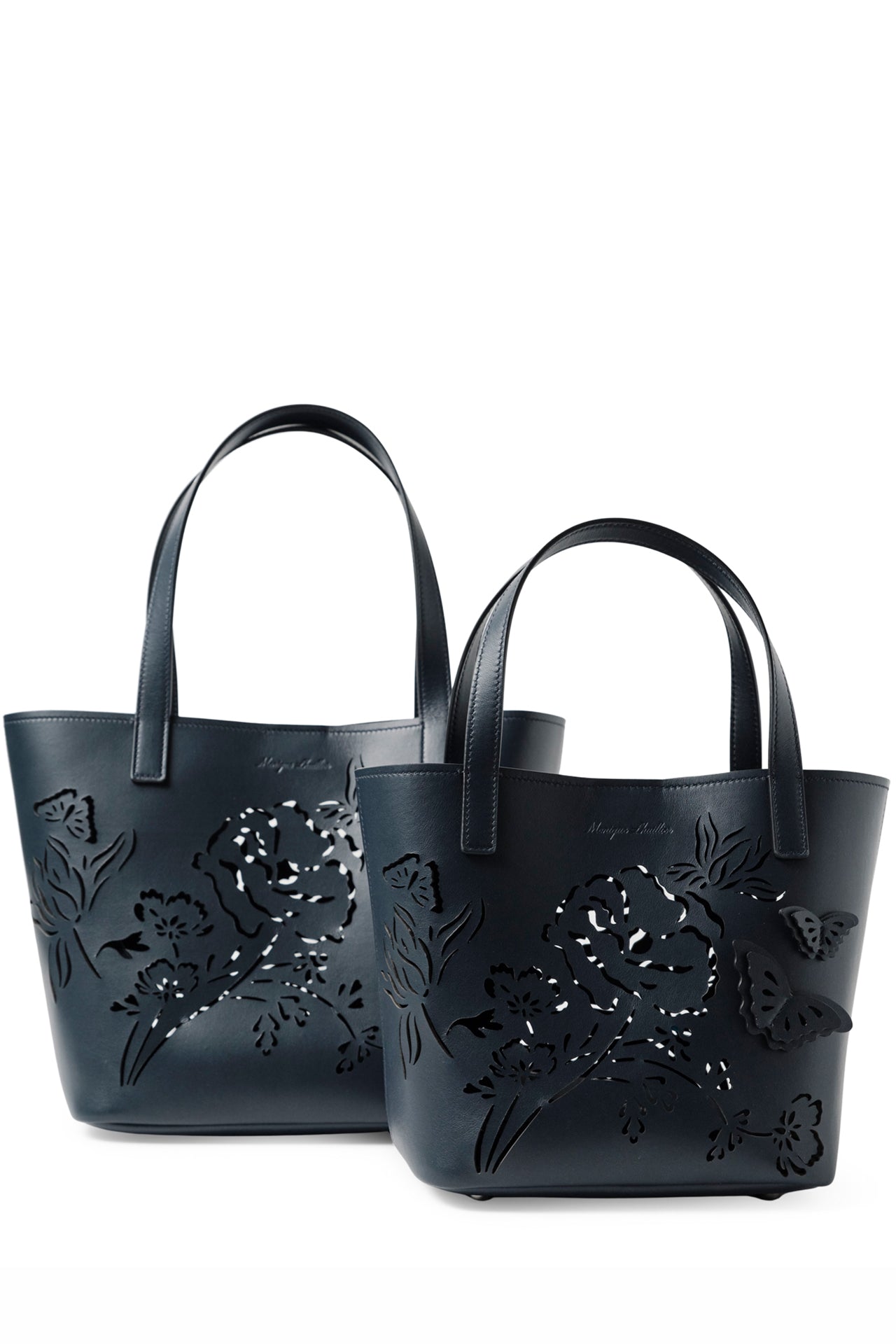 Leather top handle tote bag with laser cut florals, three-dimensional leather butterflies and small zip pouch in Navy- front, large and small tote