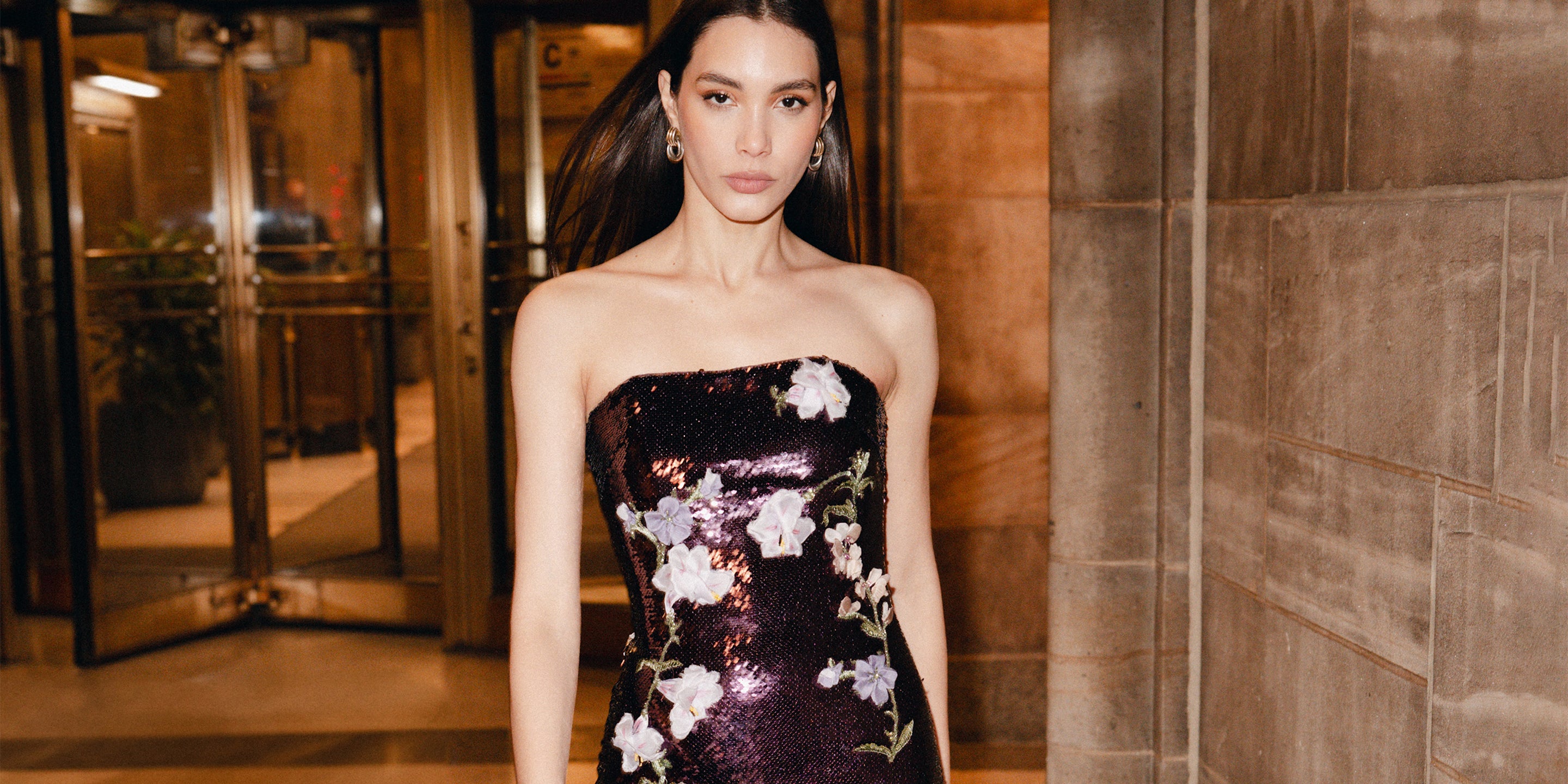 Violet sequin strapless gown with floral embroidery on model from Monique Lhuillier Fall 2025 collection.
