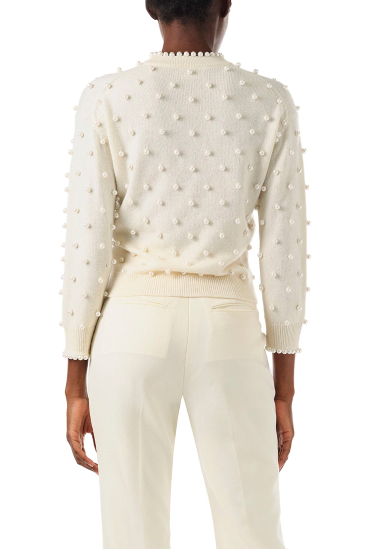 Monique Lhuillier Fall 2024 creme cashmere long sleeve sweater with pearl embroidery and trim - back.
