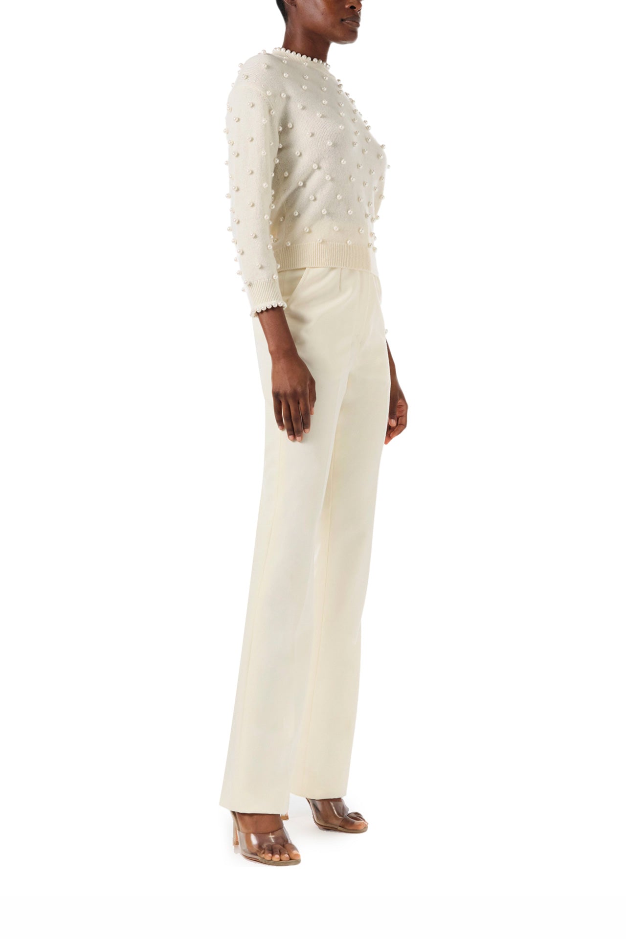 Monique Lhuillier Fall 2024 creme cashmere long sleeve sweater with pearl embroidery and trim - side.