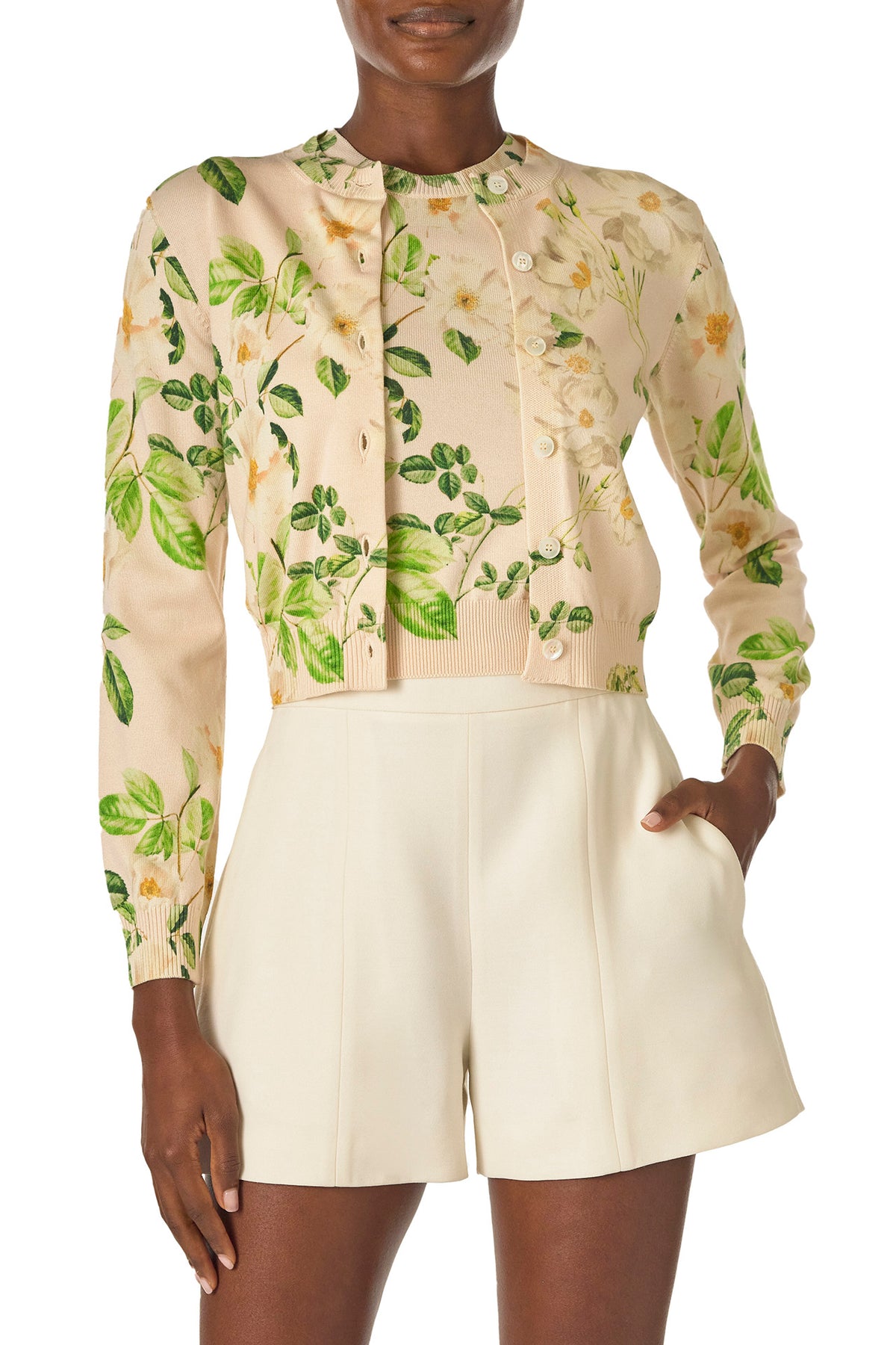 Monique Lhuillier Spring 2025 rose printed knit long sleeve cardigan with button center front closure in Bellini Multi - front.