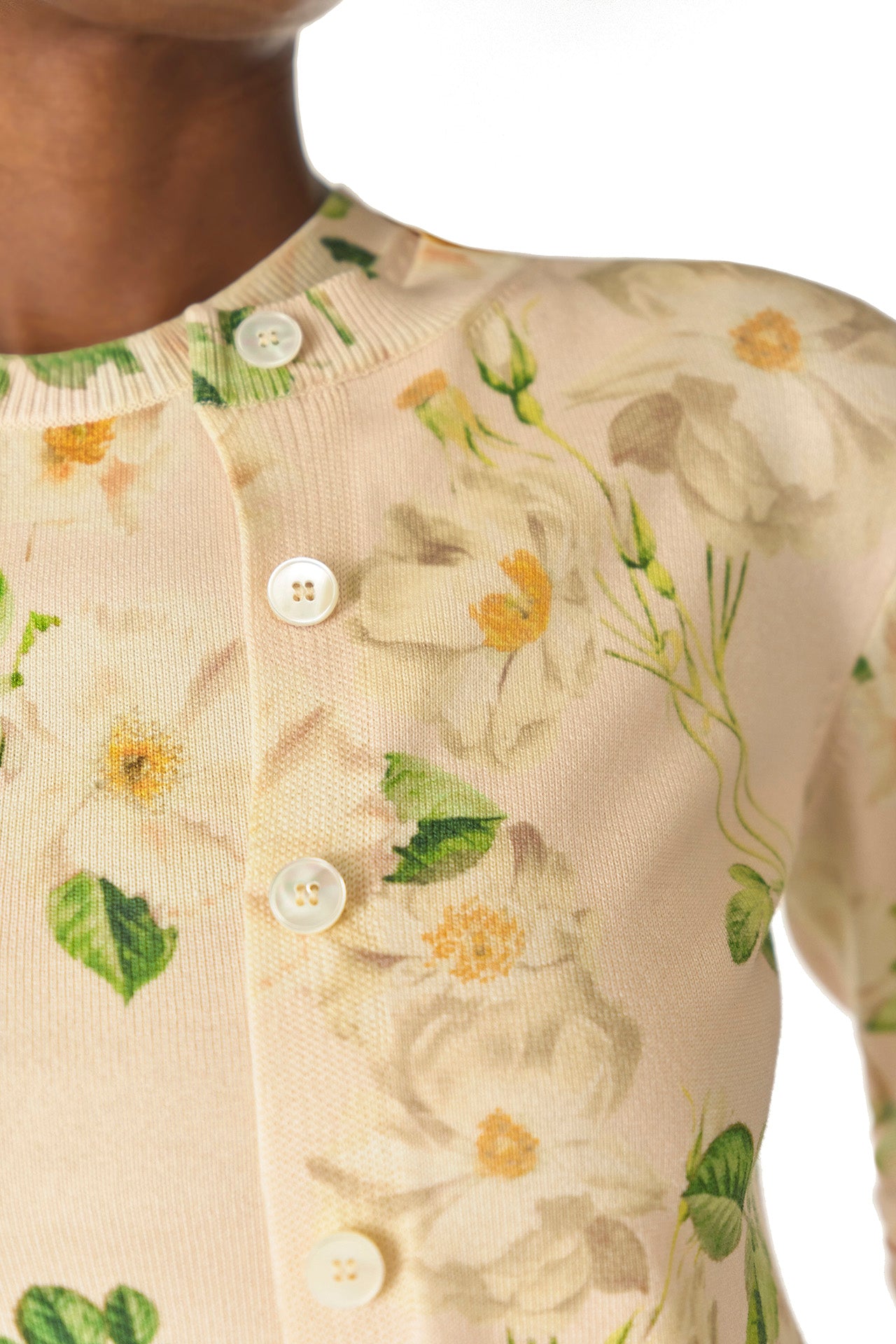 Monique Lhuillier Spring 2025 rose printed knit long sleeve cardigan with button center front closure in Bellini Multi - detail.