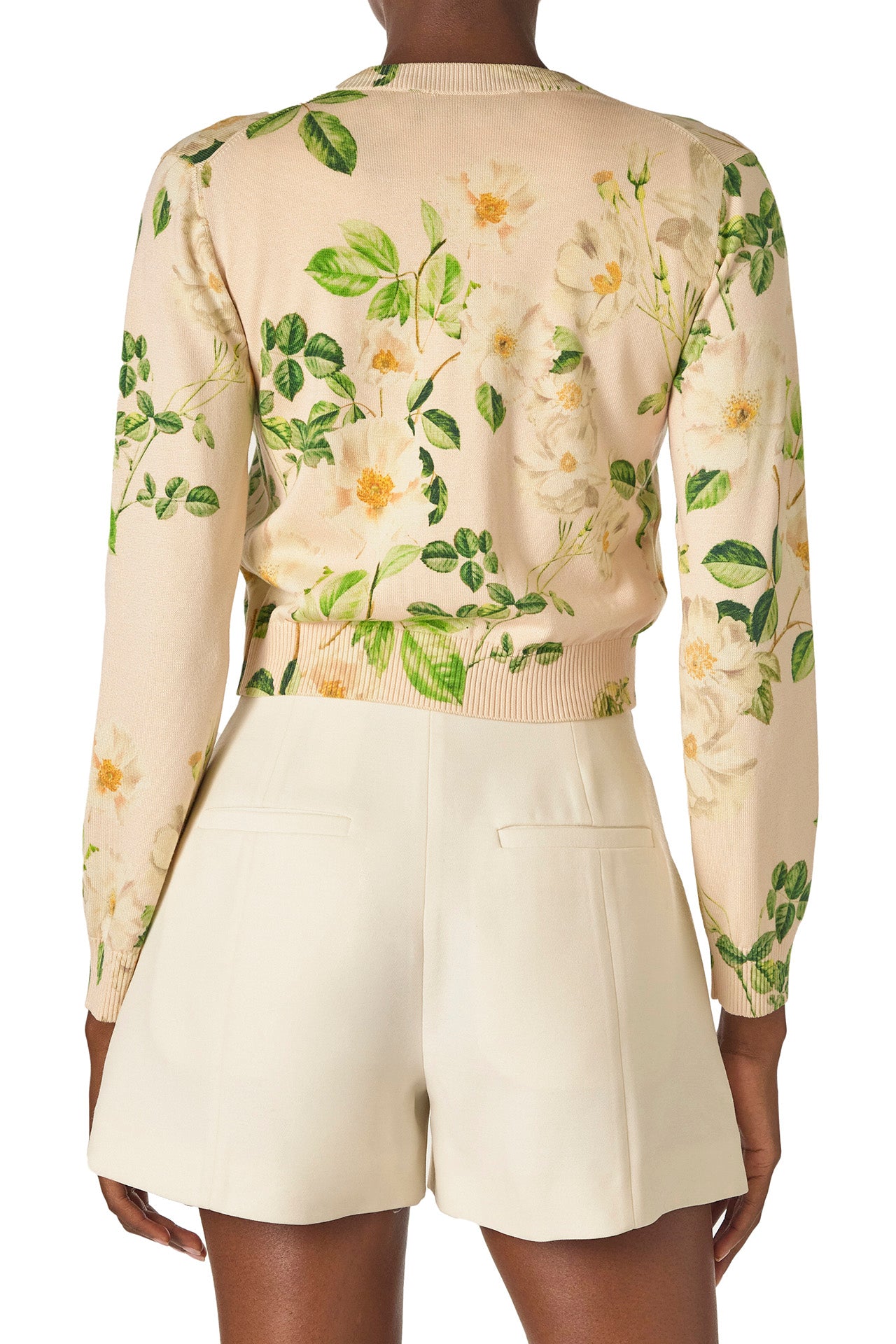 Monique Lhuillier Spring 2025 rose printed knit long sleeve cardigan with button center front closure in Bellini Multi - back.