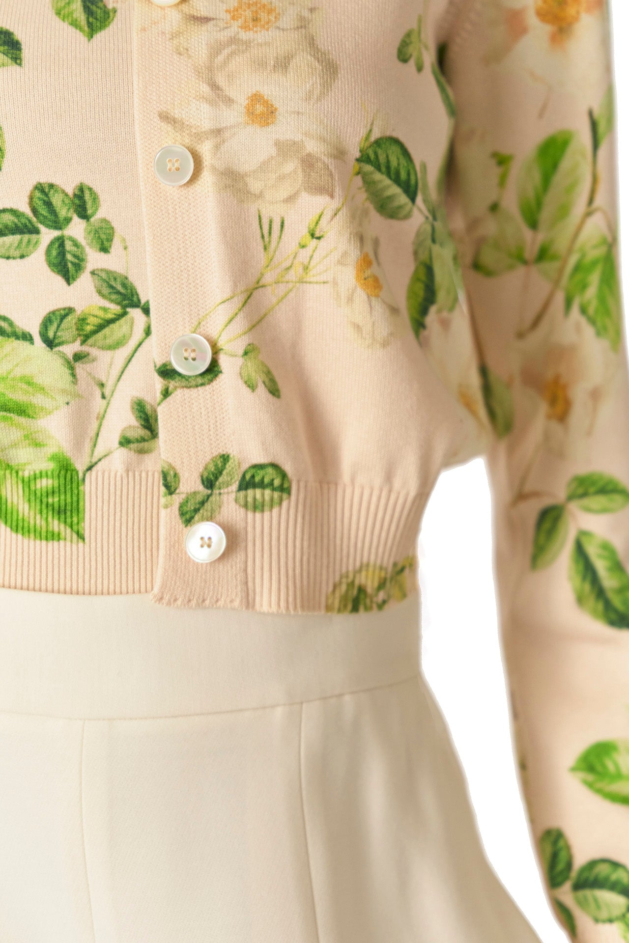 Monique Lhuillier Spring 2025 rose printed knit long sleeve cardigan with button center front closure in Bellini Multi - detail.