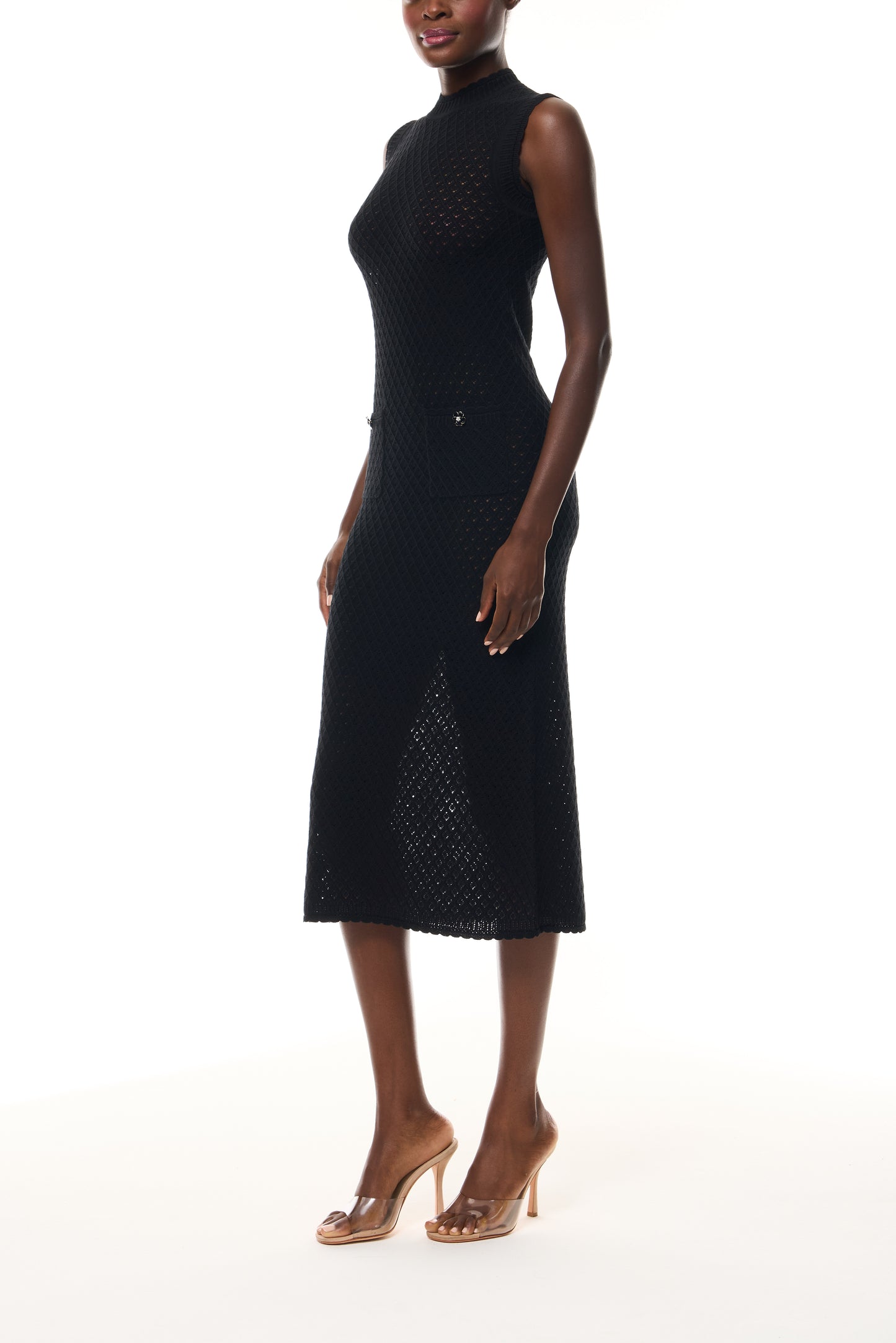 Monique Lhuillier Fall 2025 RTW Noir Sleeveless Shift Dress in Cotton Diamond Lace knit with two front pockets - side.