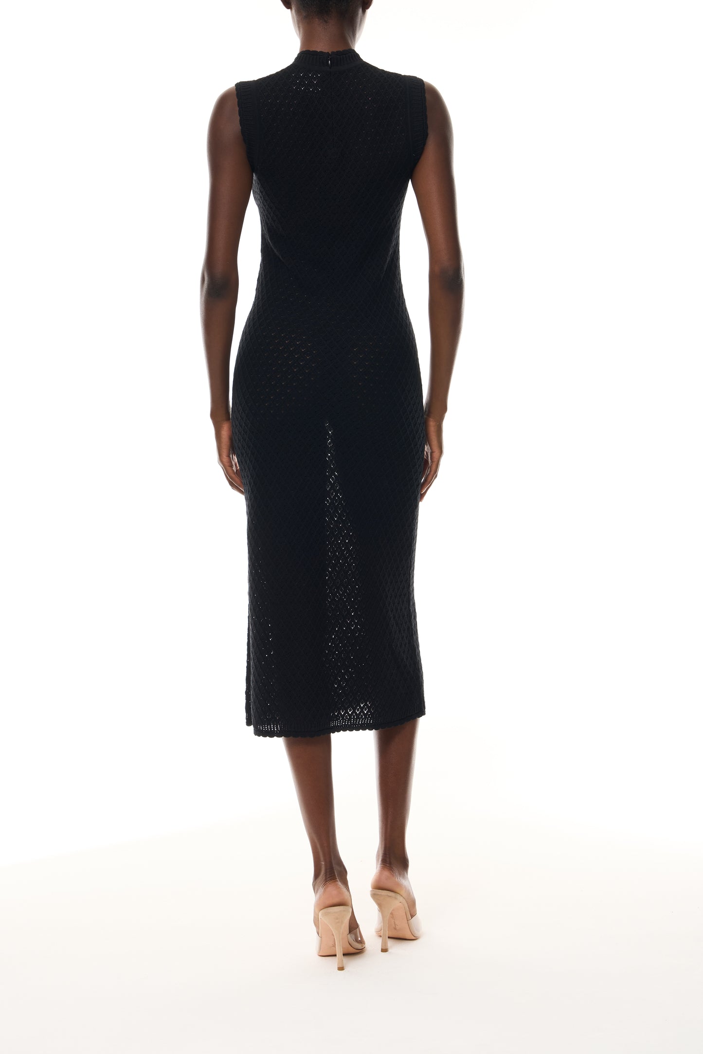Monique Lhuillier Fall 2025 RTW Noir Sleeveless Shift Dress in Cotton Diamond Lace knit with two front pockets - back.