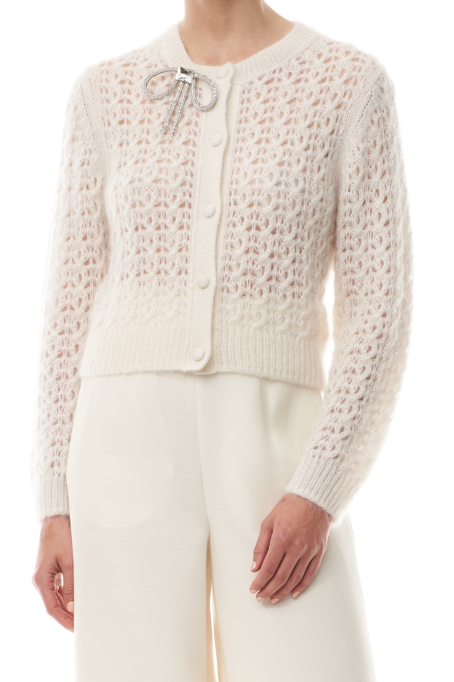 Monique Lhuillier Fall 2025 Mohair Silk Cashmere cardigan with brooch and white wide leg trouser- fabric.