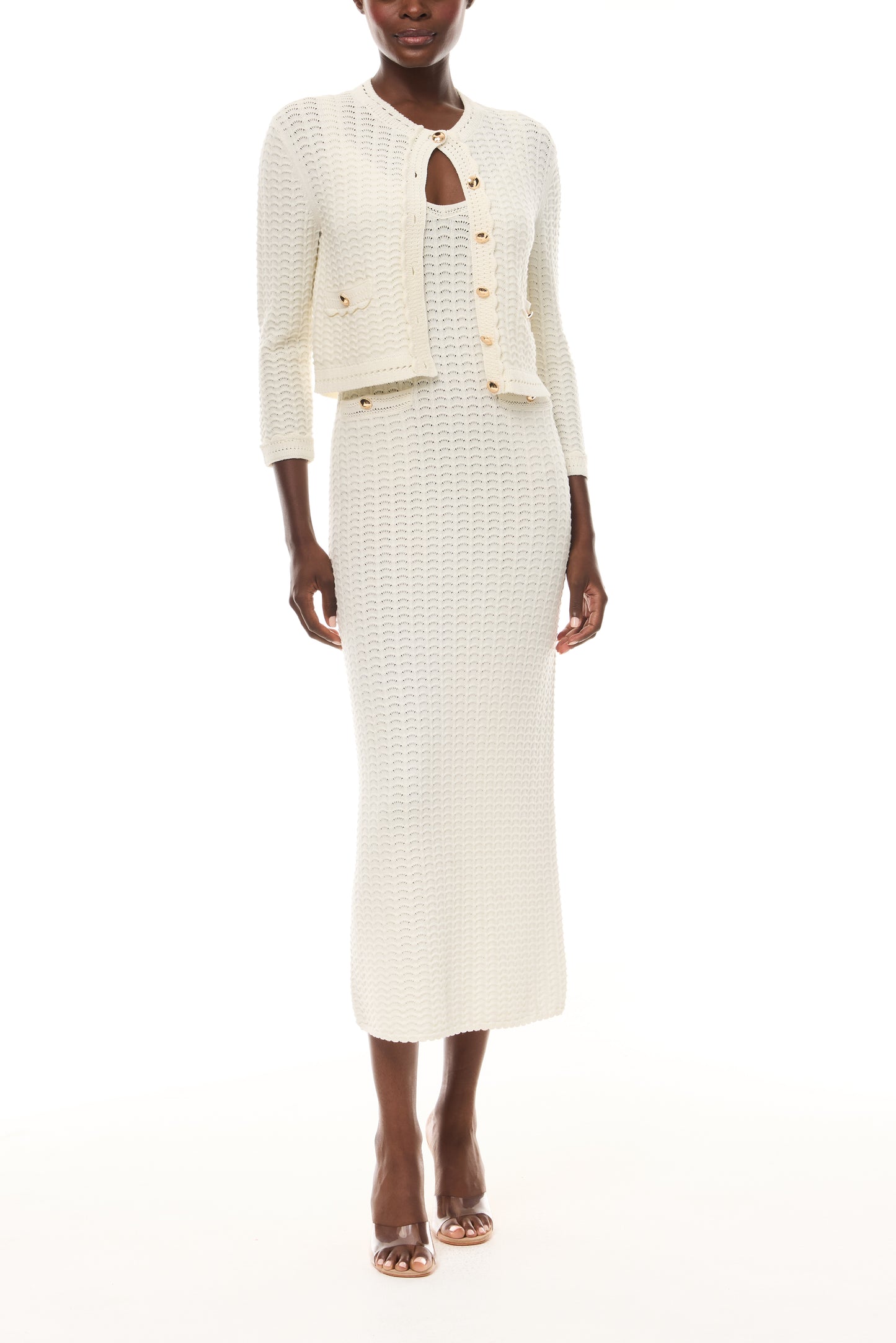 Monique Lhuillier Spring 2026 Ivory Cotton Viscose Knit Lace stitch cardigan with gold buttons with coordinating dress - front.