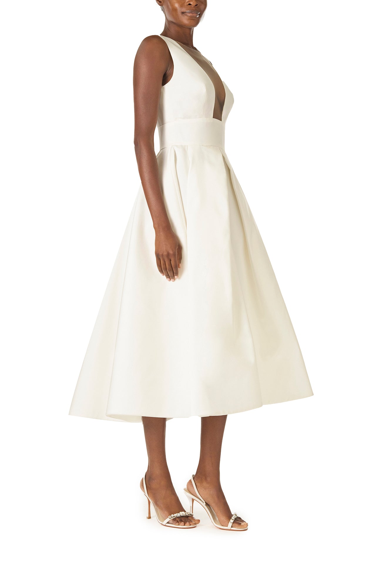 Monique Lhuillier "Kennedy" V-neck cocktail dress in Silk White Mikado fabric with pockets and nude illusion tulle at neckline - right side.