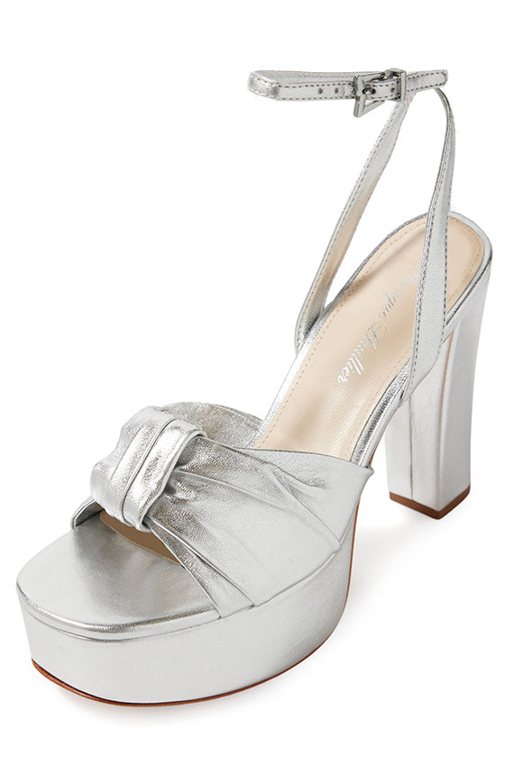 Monique Lhuillier silver leather Kris platform heel with knotted toe strap and silver hardware.