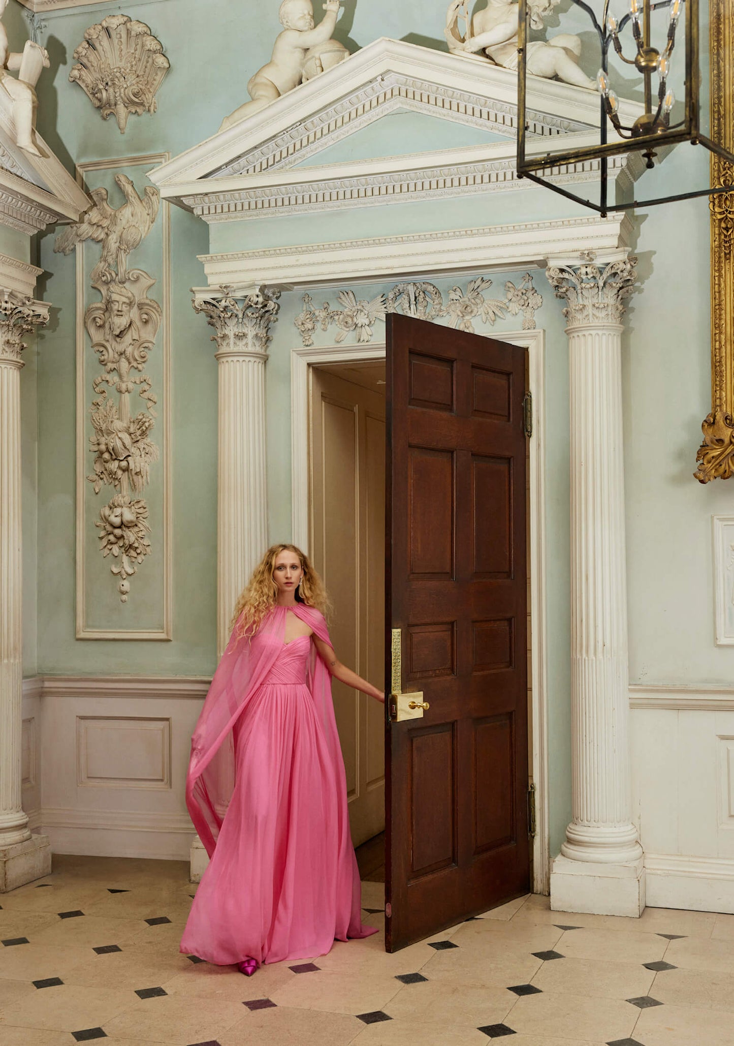 Monique Lhuillier Fall 2024 floor length, sheer pink chiffon cape - look book photo.