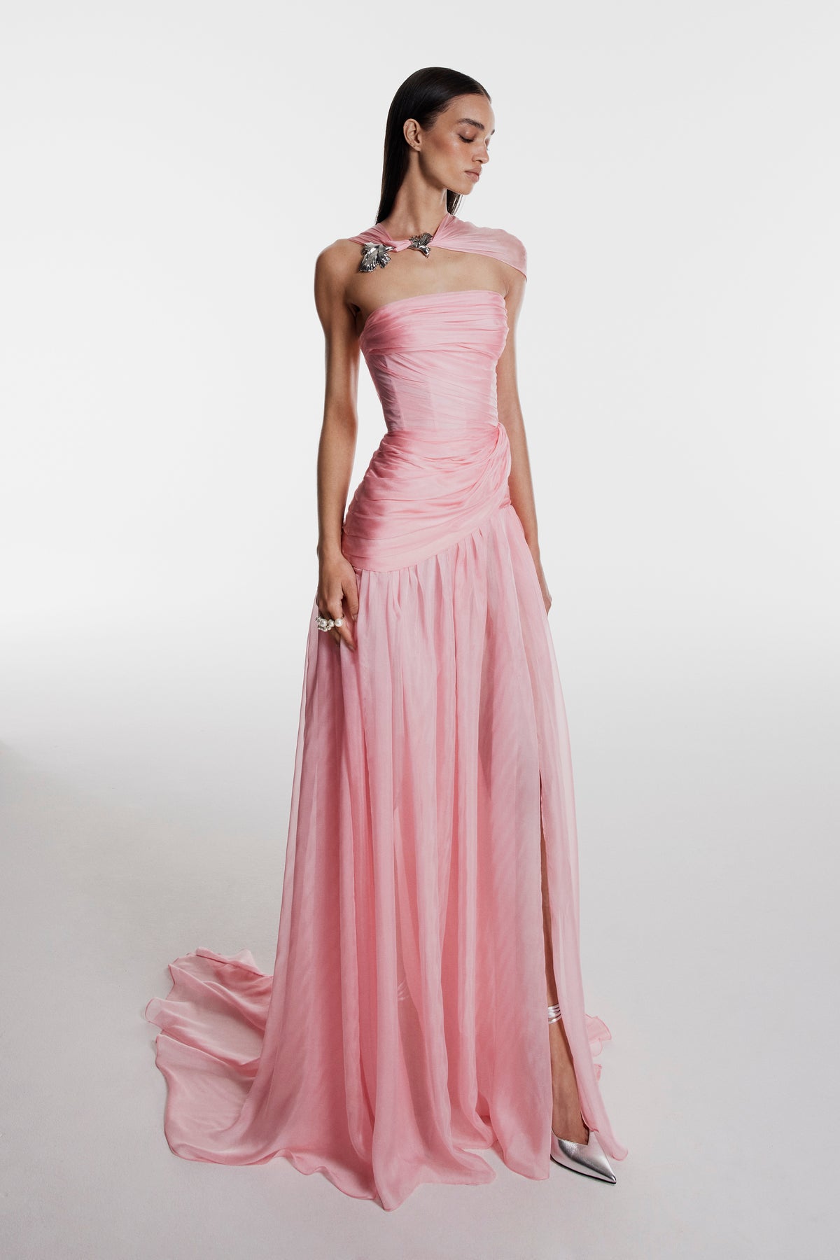 Monique Lhuillier Fall 2026 pink iridescent chiffon strapless asymmetric draped gown with scarf and floral embellishment- lookbook.