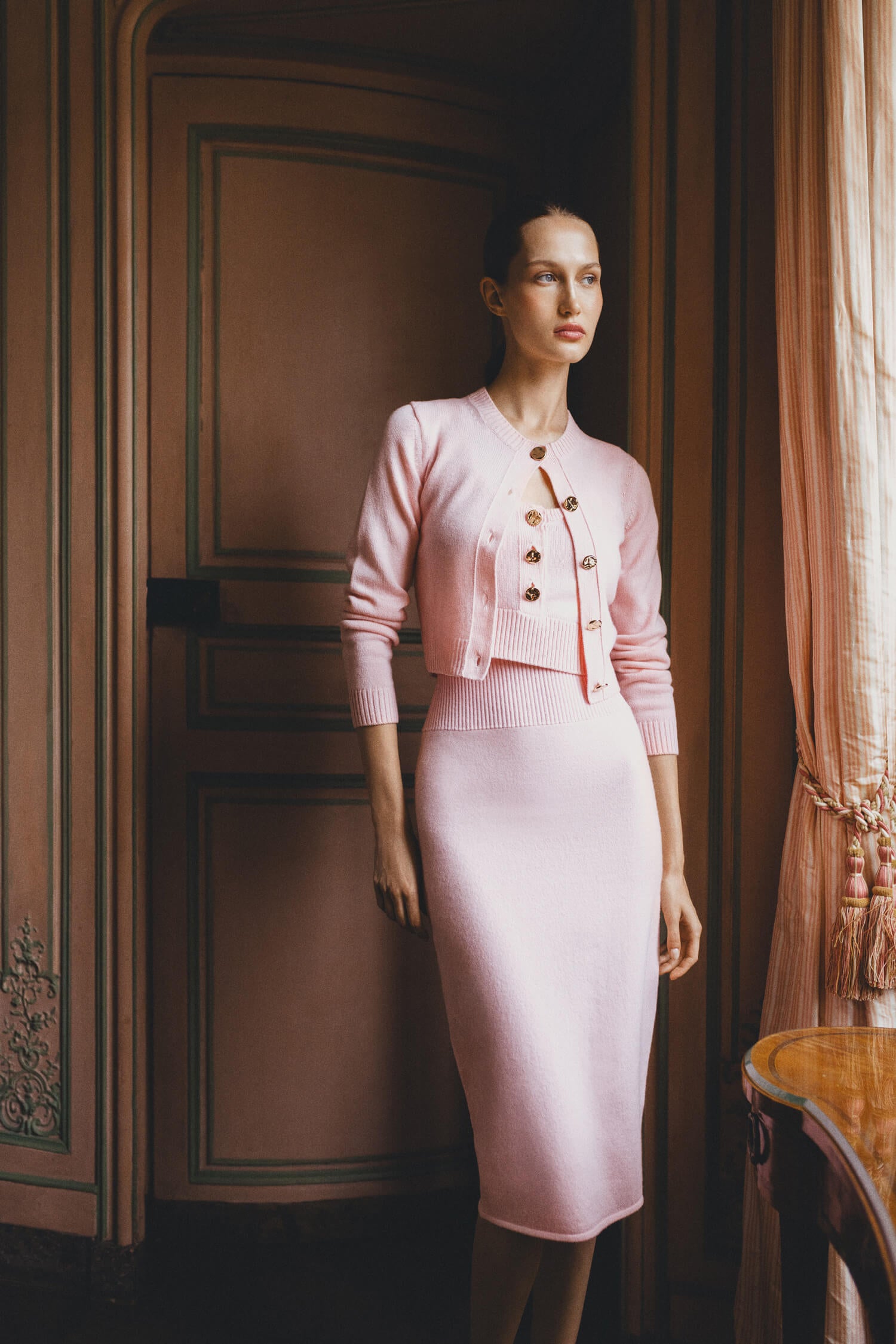 Monique Lhuillier pink cashmere cropped tank with gold buttons.