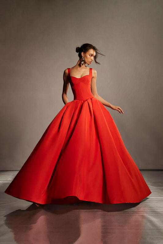 Monique Lhuillier Spring 2026 lookbook image - model wearing Poppy faille scoop neck basque waist pleated ballgown