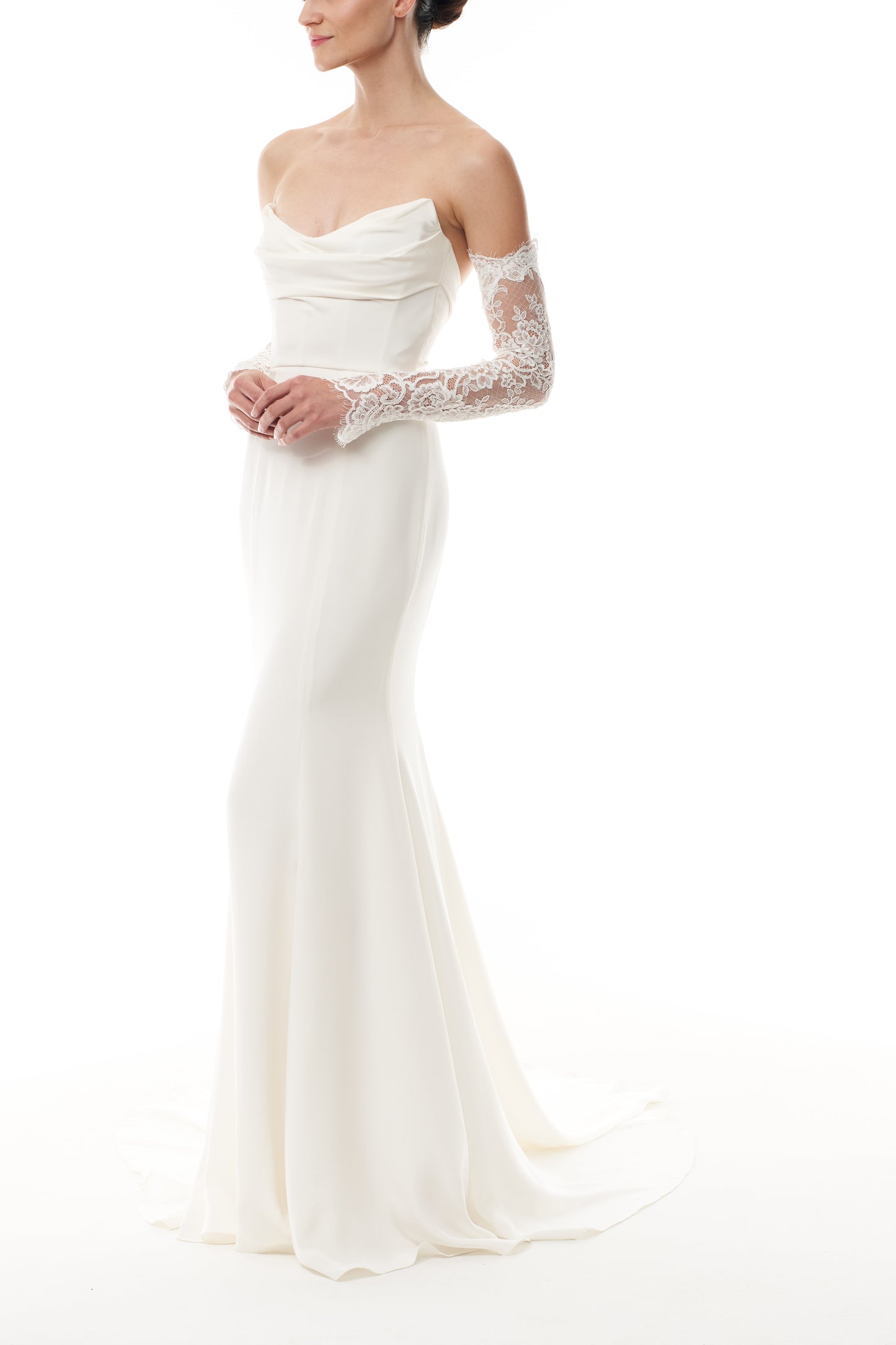 Long sleeve silk white lace sleeves shown with a strapless silk white satin gown - side.