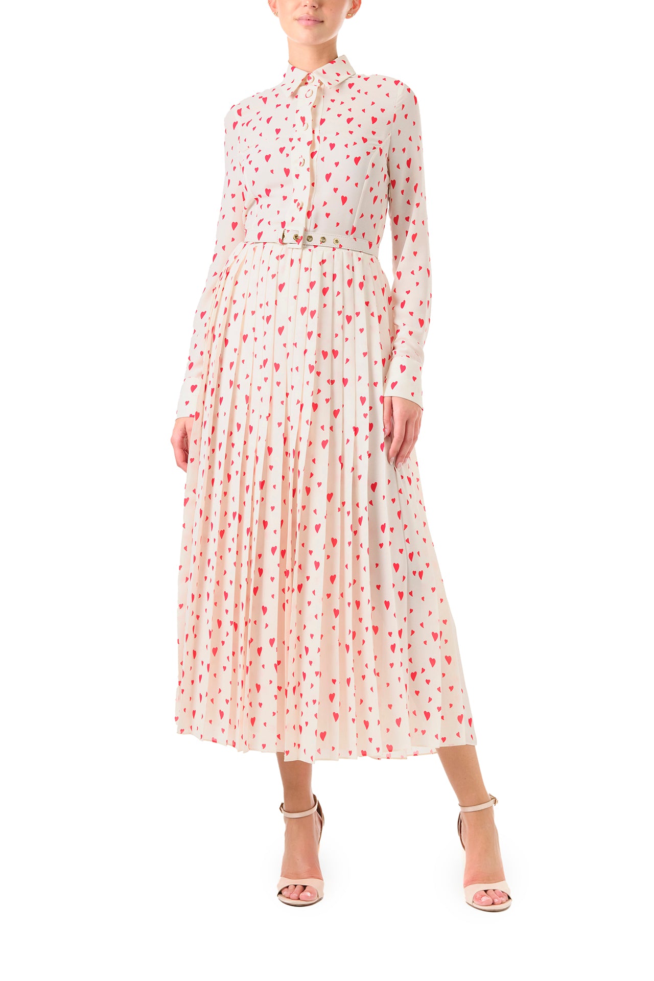 Monique Lhuillier Fall 2024 long sleeve, shirt dress with pleated skirt and belted waist in Heart Print Georgette. Collared neckline and button closure - front.