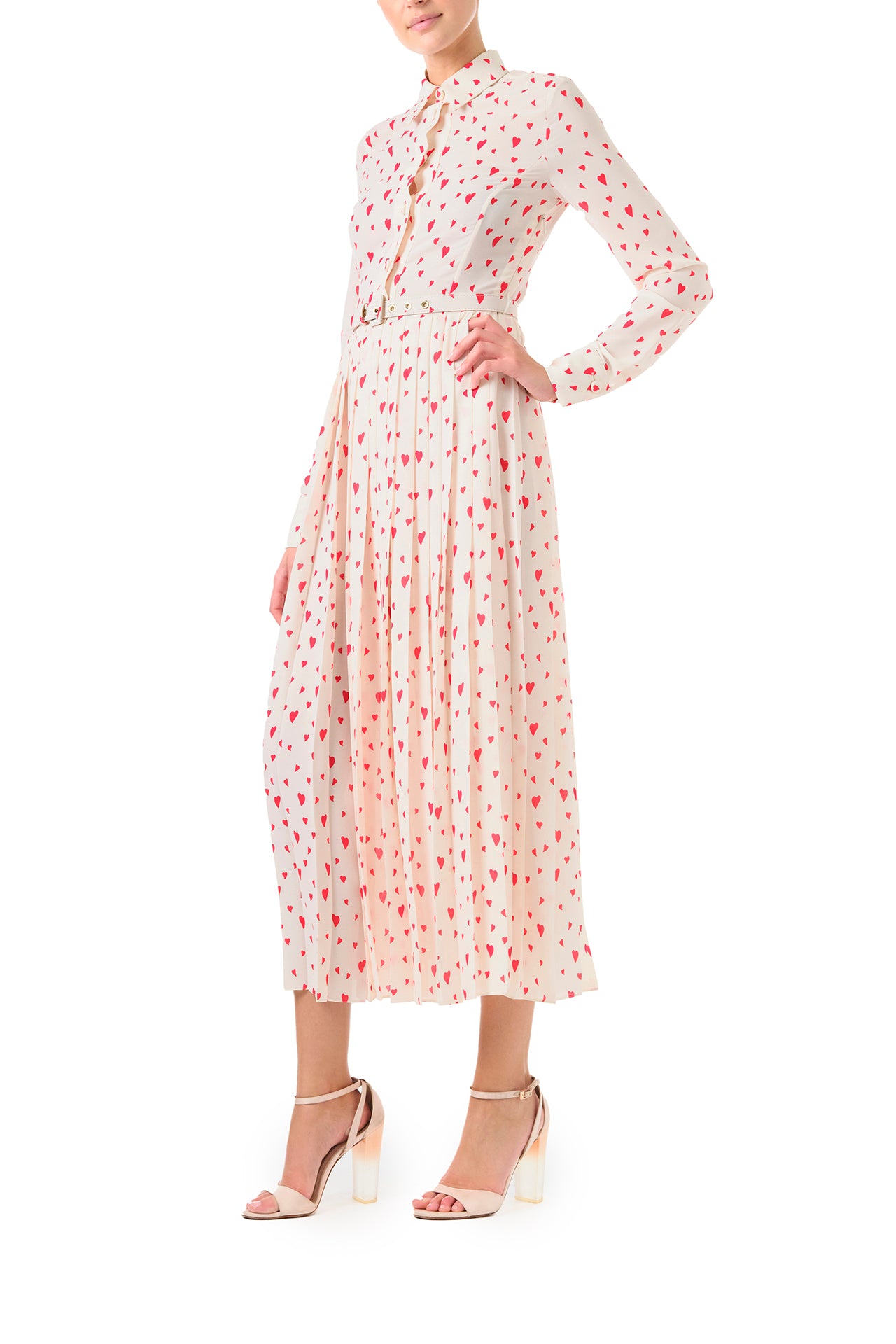 Monique Lhuillier Fall 2024 long sleeve, shirt dress with pleated skirt and belted waist in Heart Print Georgette. Collared neckline and button closure - side.