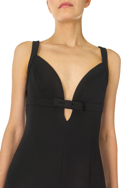 Monique Lhuillier Spring 2025 Mini dress with deep v-neckline and front bow detail in Noir wool/silk suiting fabric - neckline.