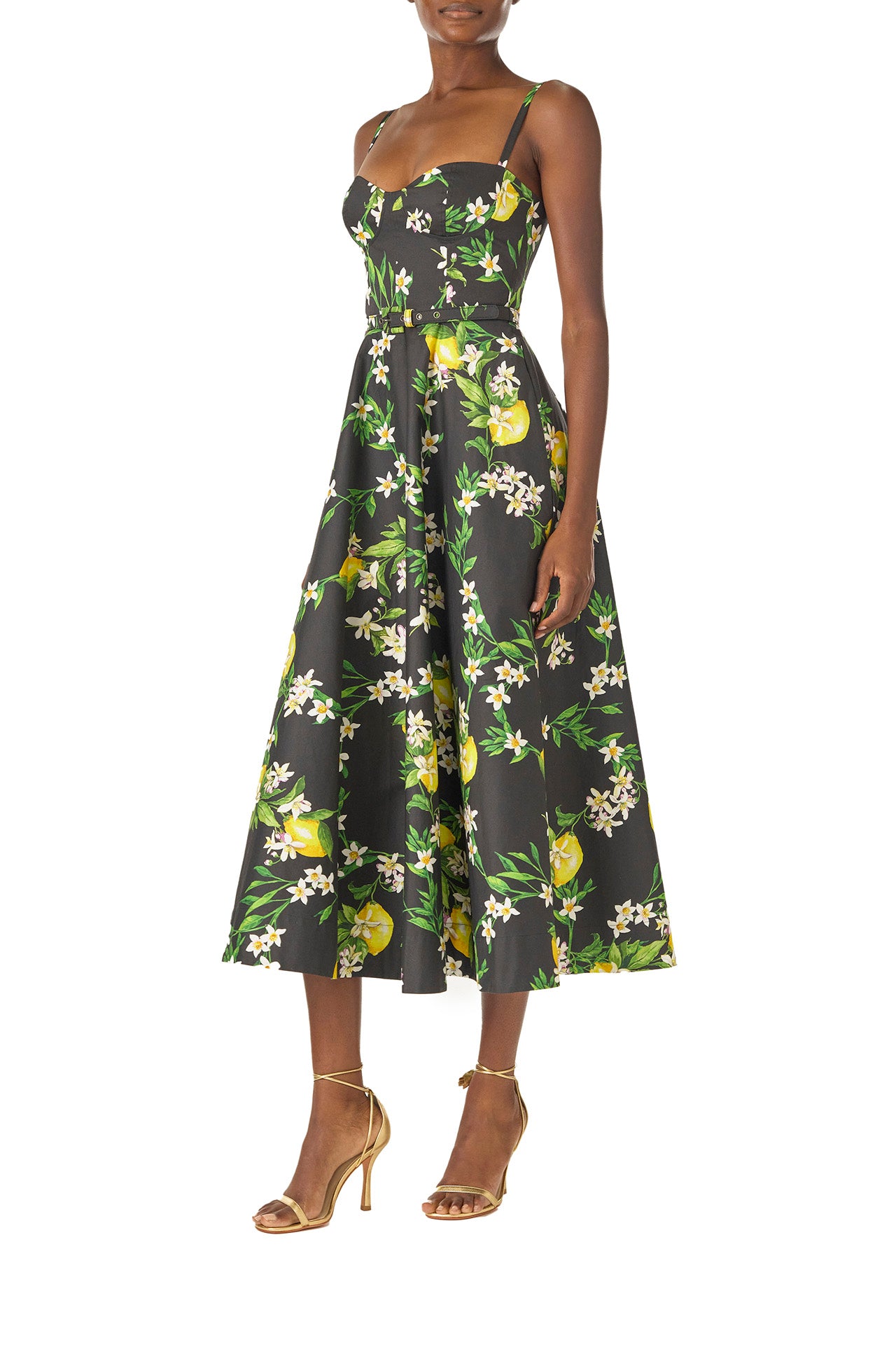 Monique Lhuillier Spring 2025 A-line midi dress with spaghetti straps, corseted bodice and pockets in Lemon printed cotton poplin - left side.