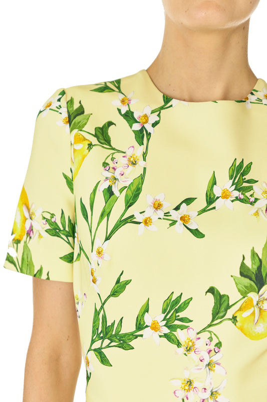 Monique Lhuillier Spring 2025 Short sleeve, floor length gown with jewel neckline in Lemon printed Crepe fabric - fabric detail.