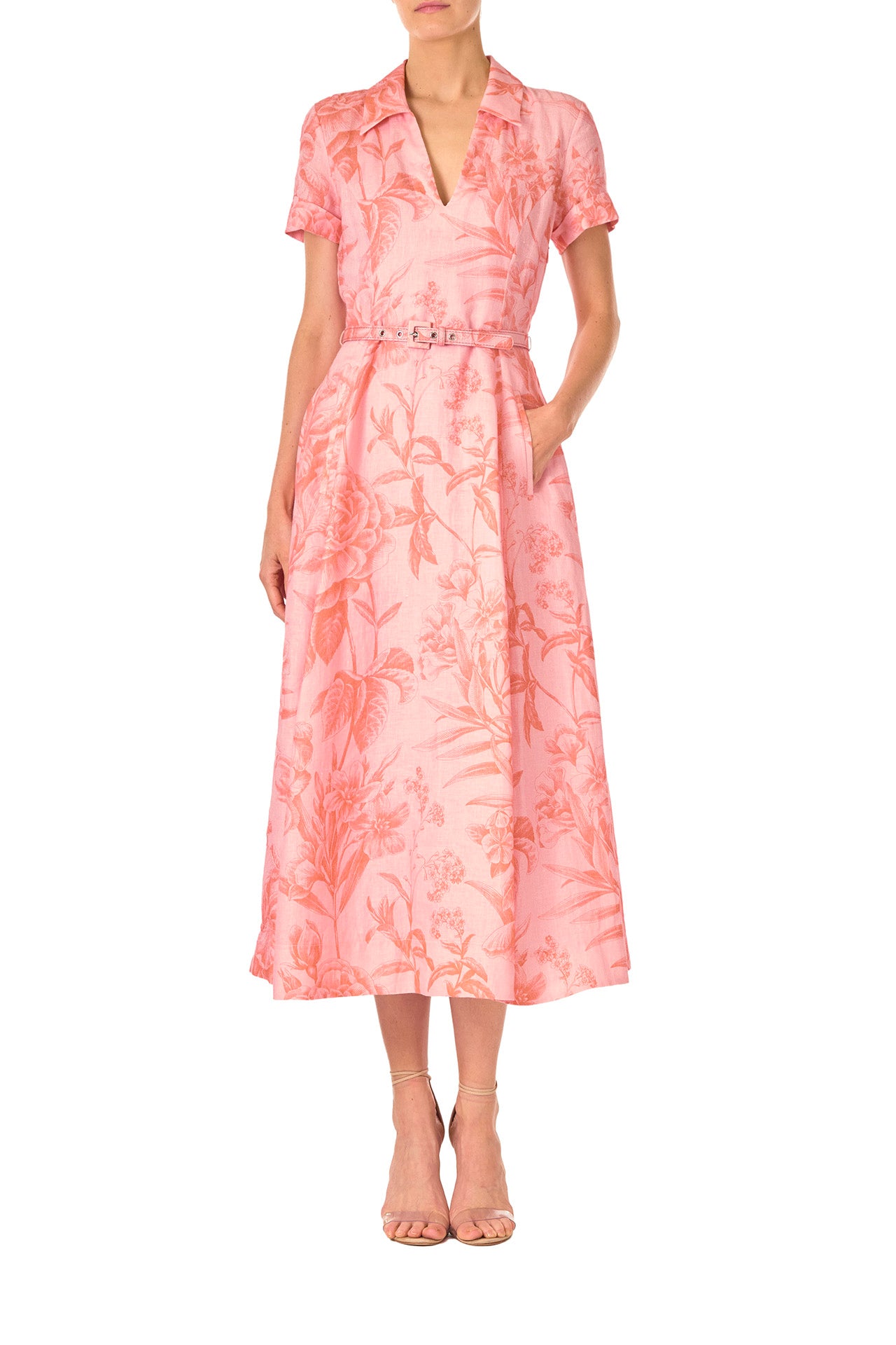 Monique Lhuillier Spring 2025 Floral printed linen dress with a-line skirt, short sleeves and pockets in Rosette Coral - front.