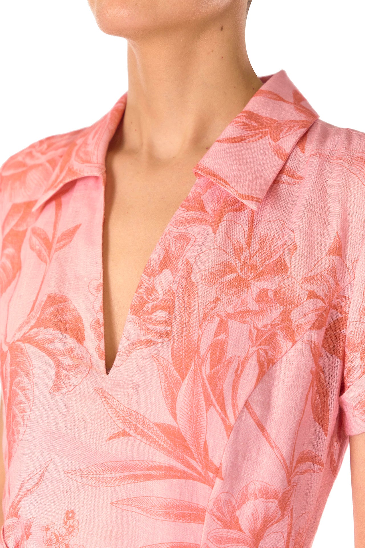 Monique Lhuillier Spring 2025 Floral printed linen dress with a-line skirt, short sleeves and pockets in Rosette Coral - neckline.