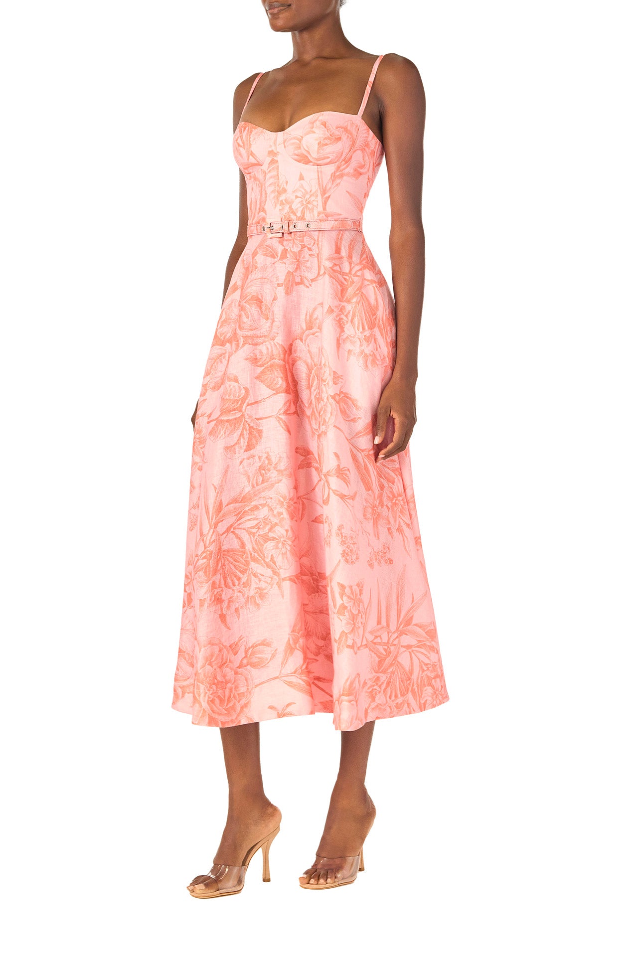 Monique Lhuillier Spring 2025 Floral printed a-line midi dress with spaghetti straps, corseted bodice and pockets in Rosette Coral colored linen - side.