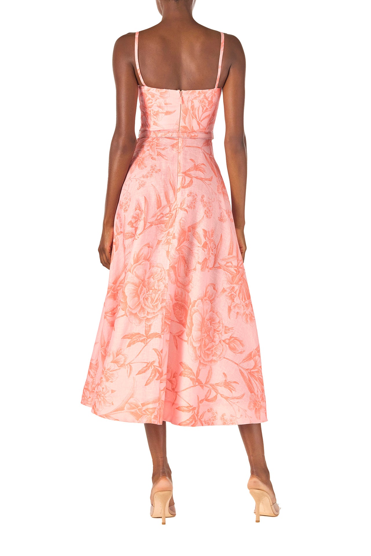 Monique Lhuillier Spring 2025 Floral printed a-line midi dress with spaghetti straps, corseted bodice and pockets in Rosette Coral colored linen - back.