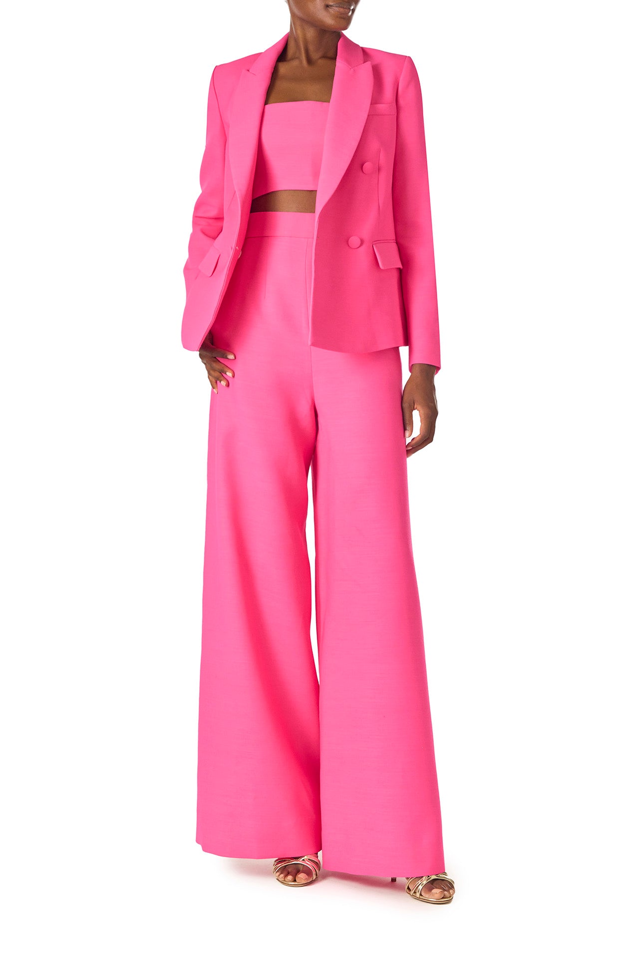 Monique Lhuillier Spring 2025 double-breasted tuxedo jacket in hibiscus wool-silk suiting - front with palazzo trousers.